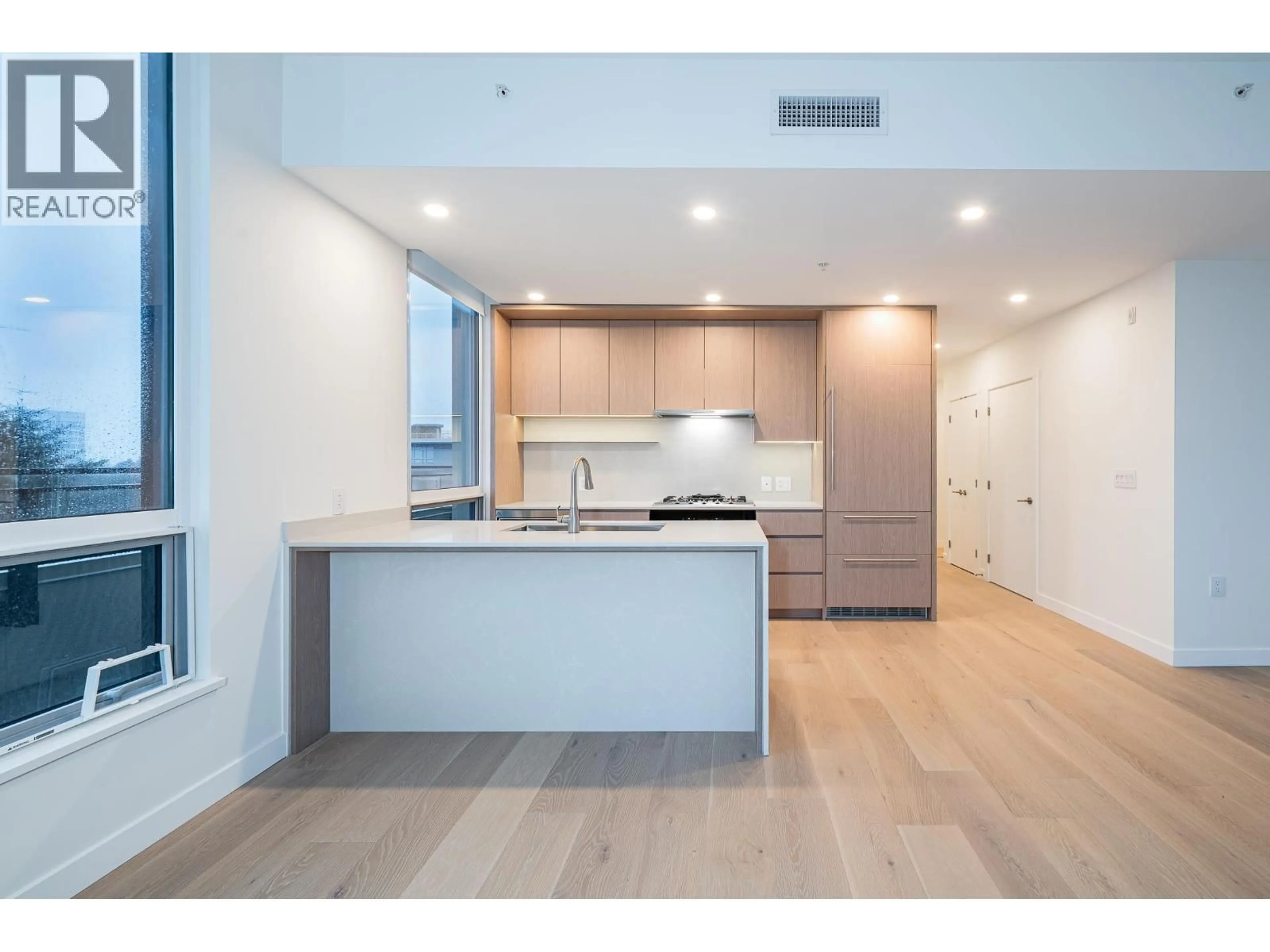Open concept kitchen, wood/laminate floor for 503 - 5212 CAMBIE STREET, Vancouver British Columbia V5Z2Z7