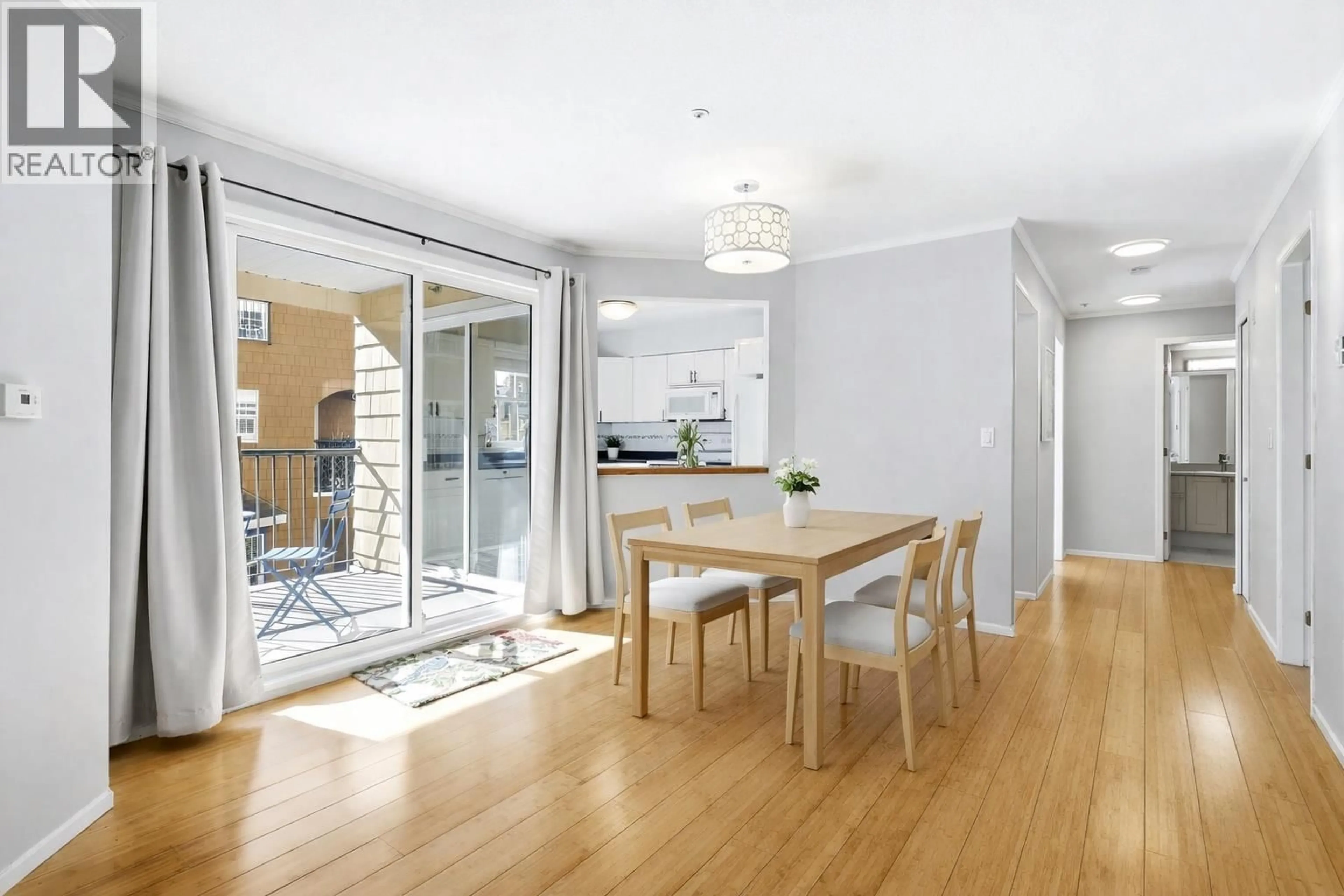 Dining room, wood/laminate floor for 206 - 5556 14 AVENUE, Delta British Columbia V4M4E7