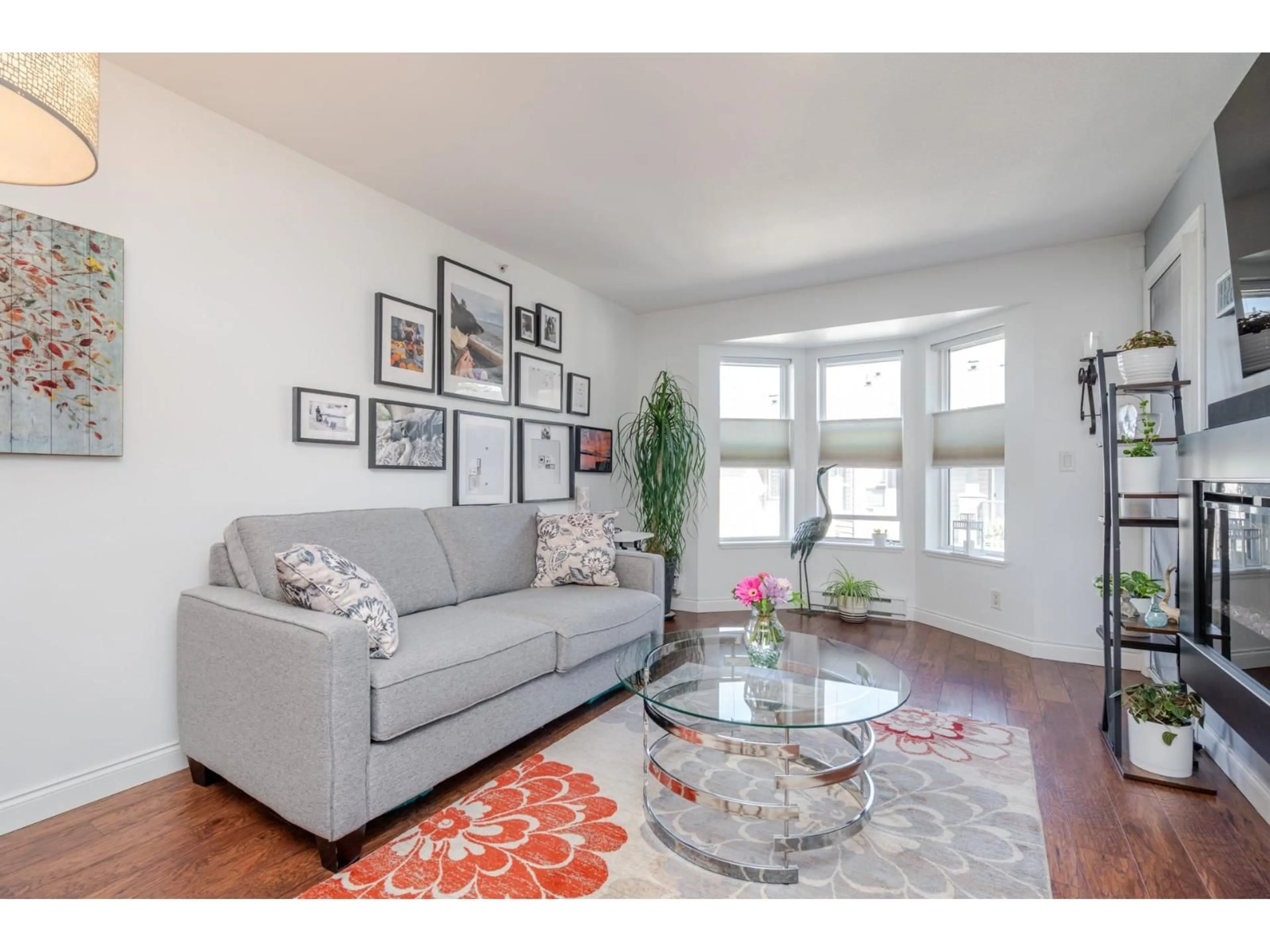 Living room with furniture, wood/laminate floor for 409 - 5474 198TH STREET, Langley British Columbia V3A1G2