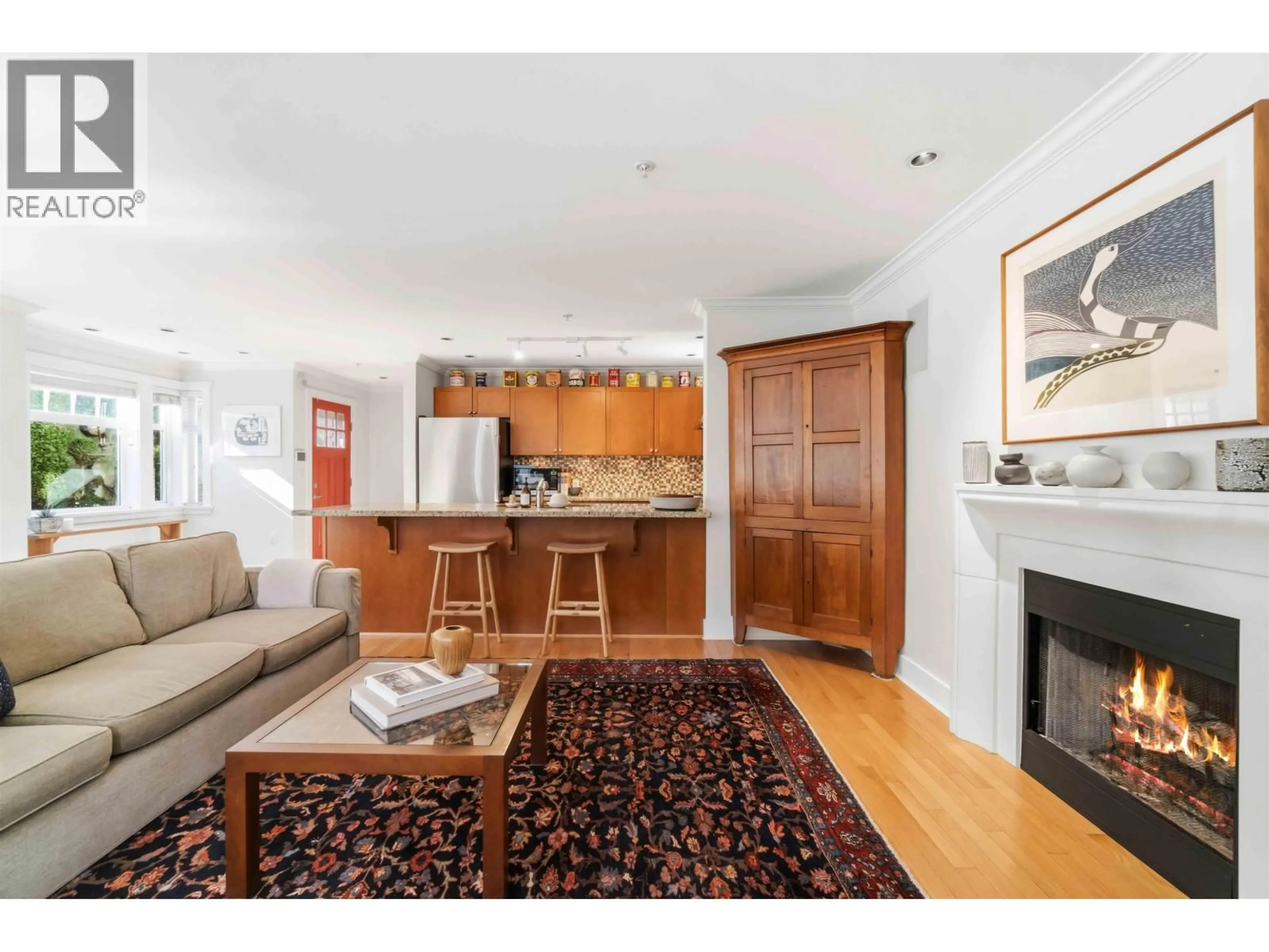 Living room with furniture, wood/laminate floor for 2420 SASAMAT STREET, Vancouver British Columbia V6R4S8