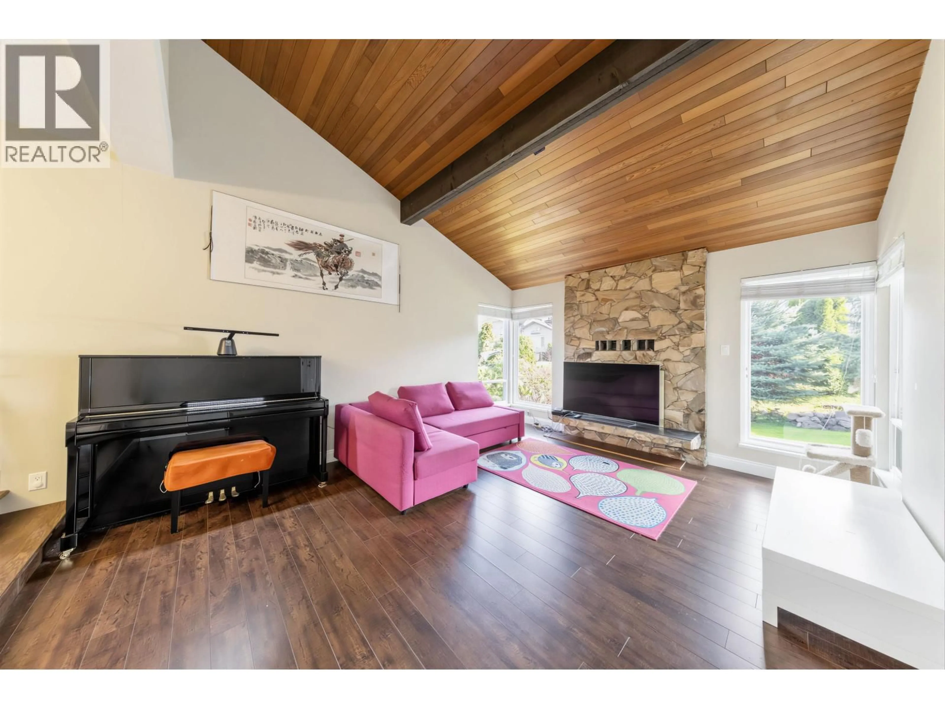 Living room with furniture, wood/laminate floor for 7763 HAZELMERE STREET, Burnaby British Columbia V5E2B3