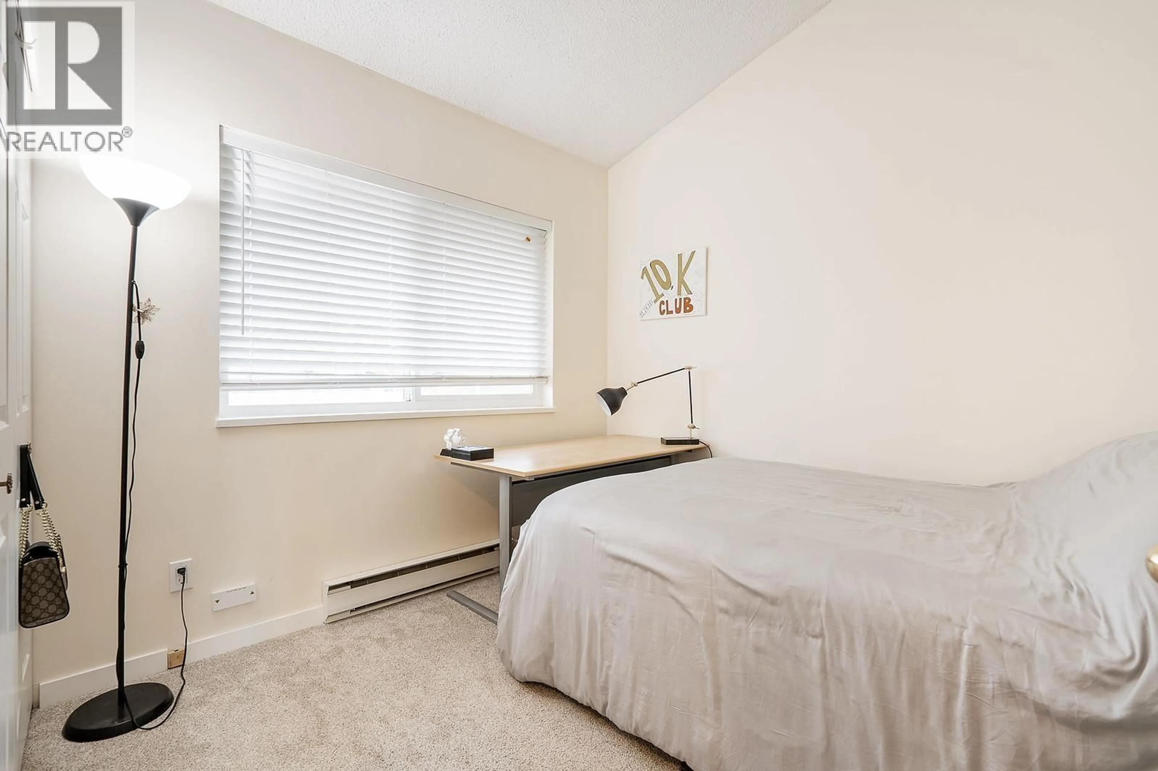 Bedroom with bed, floor is not visible for 305 - 11726 225TH STREET, Maple Ridge British Columbia V2X6E4