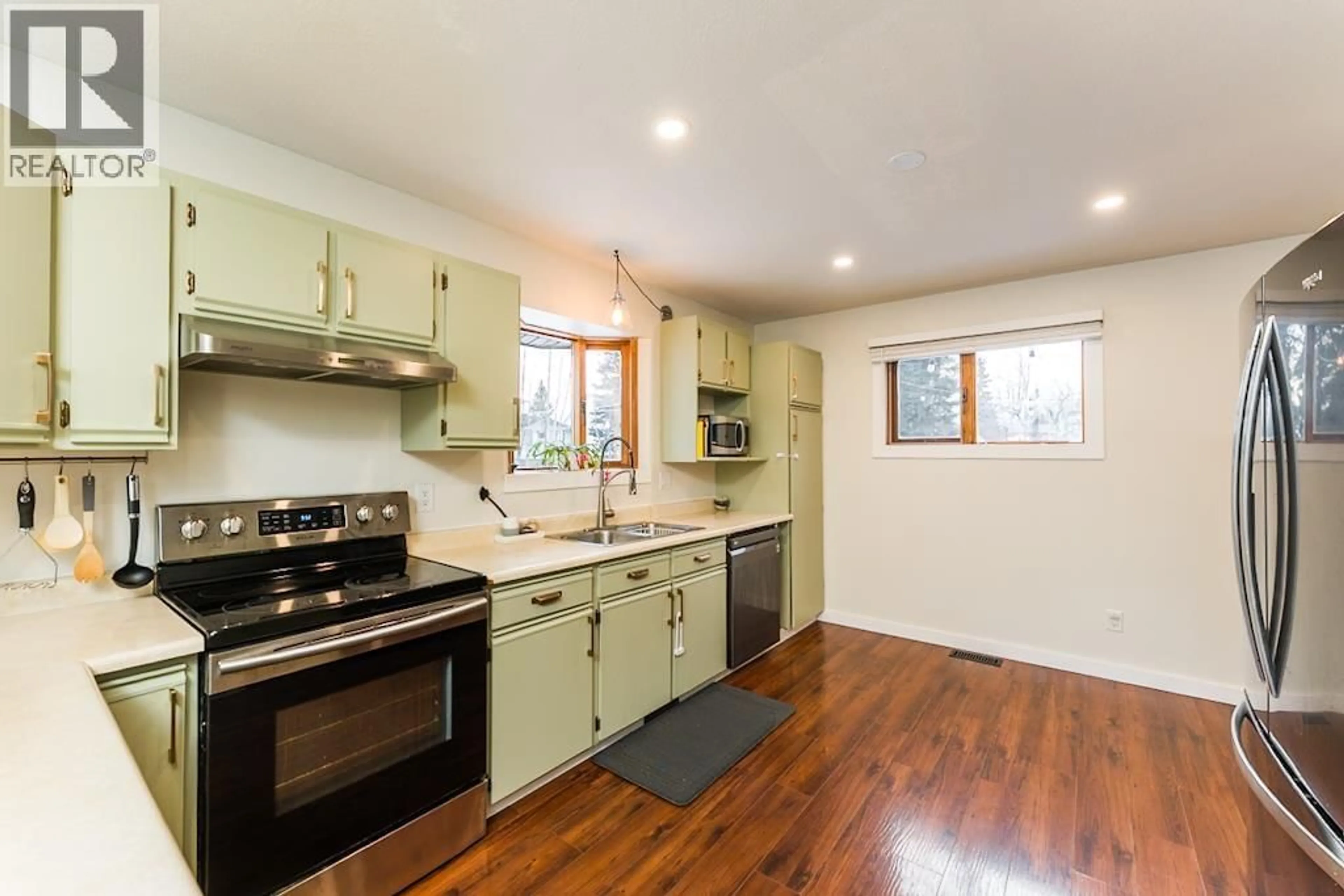 Open concept kitchen, wood/laminate floor for 3067 WHITESAIL PLACE, Prince George British Columbia V2K4E3