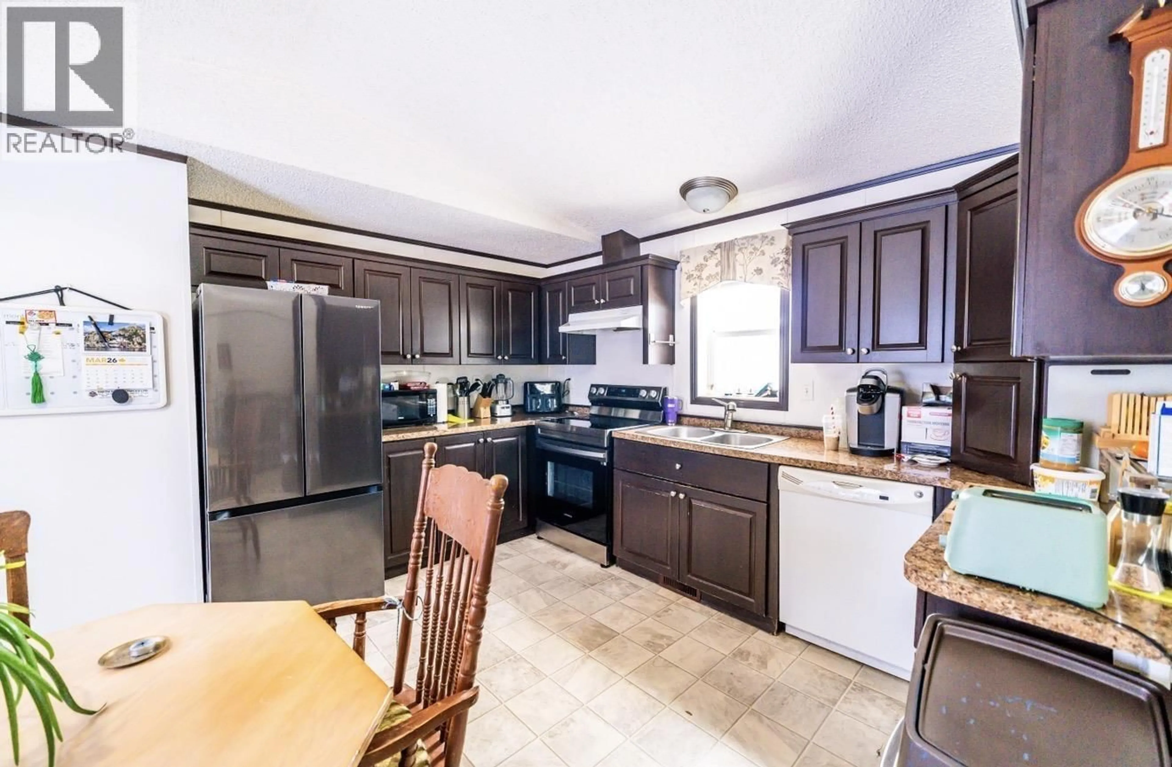Open concept kitchen, ceramic/tile floor for 8920 75 STREET, Fort St. John British Columbia V1J2Z2