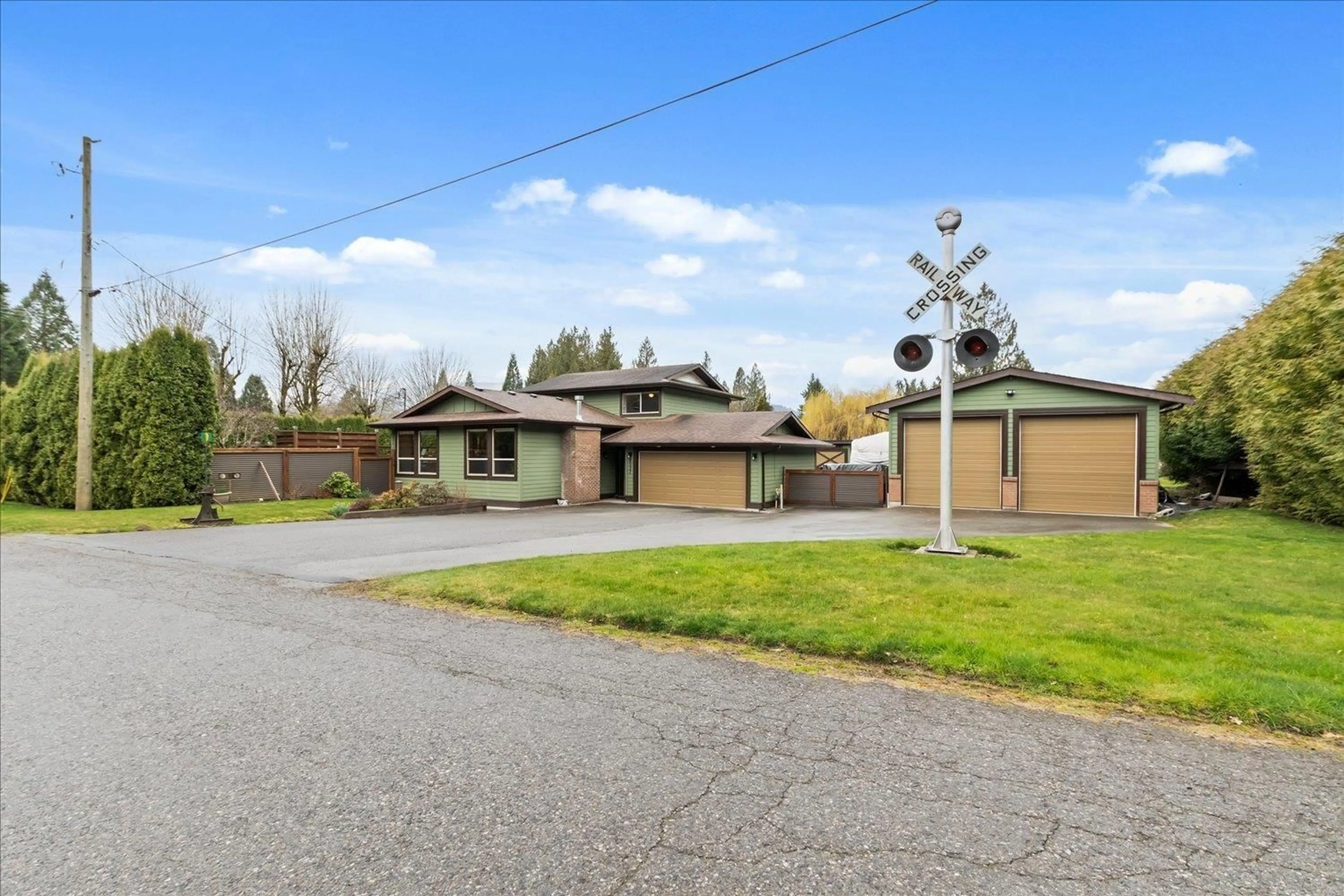 A pic from outside/outdoor area/front of a property/back of a property/a pic from drone, street for 4537 MCFAUL ROAD, Chilliwack British Columbia V2R4N2