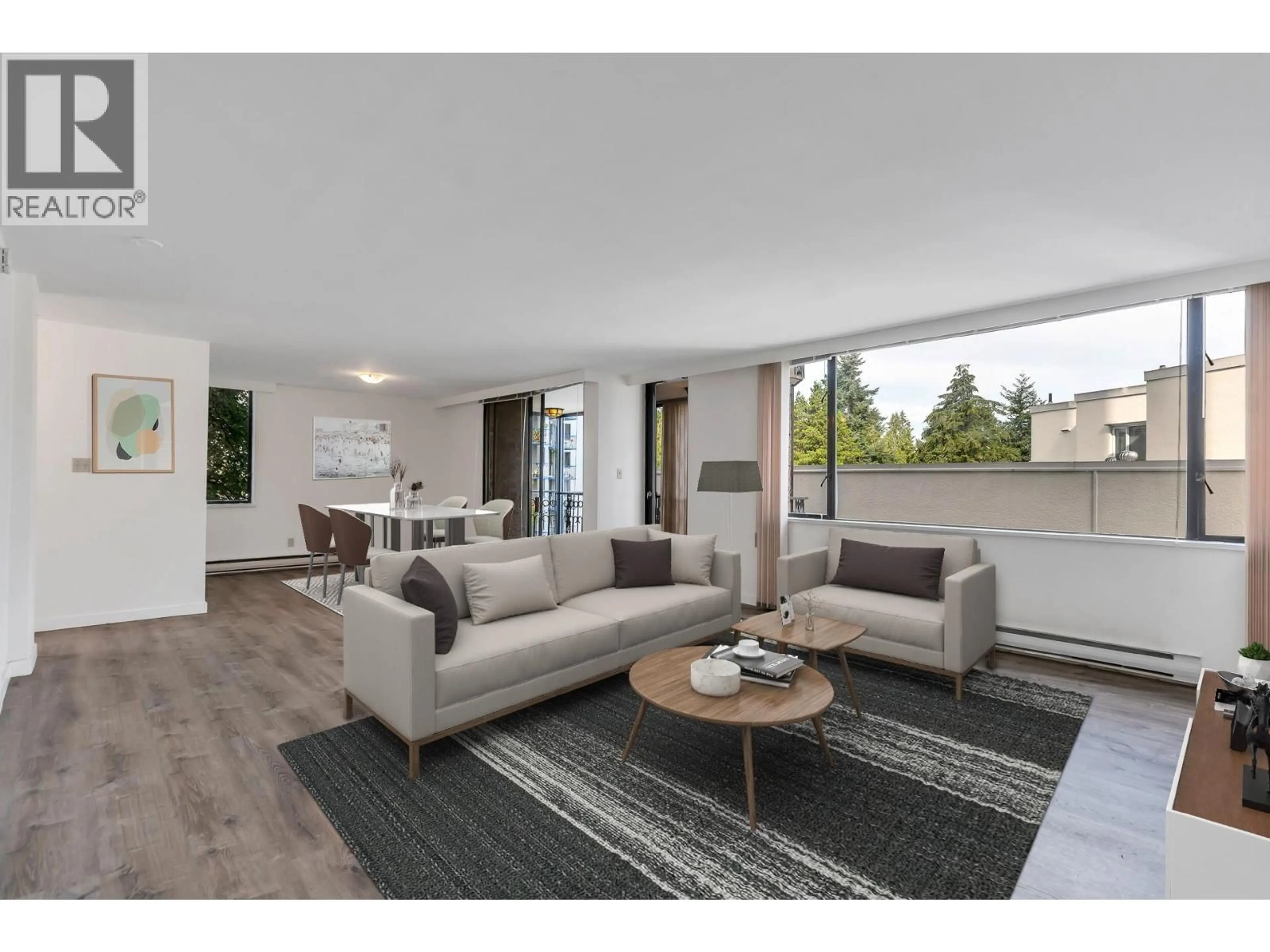 Living room with furniture, wood/laminate floor for 201 - 845 CHILCO STREET, Vancouver British Columbia V6G2R2