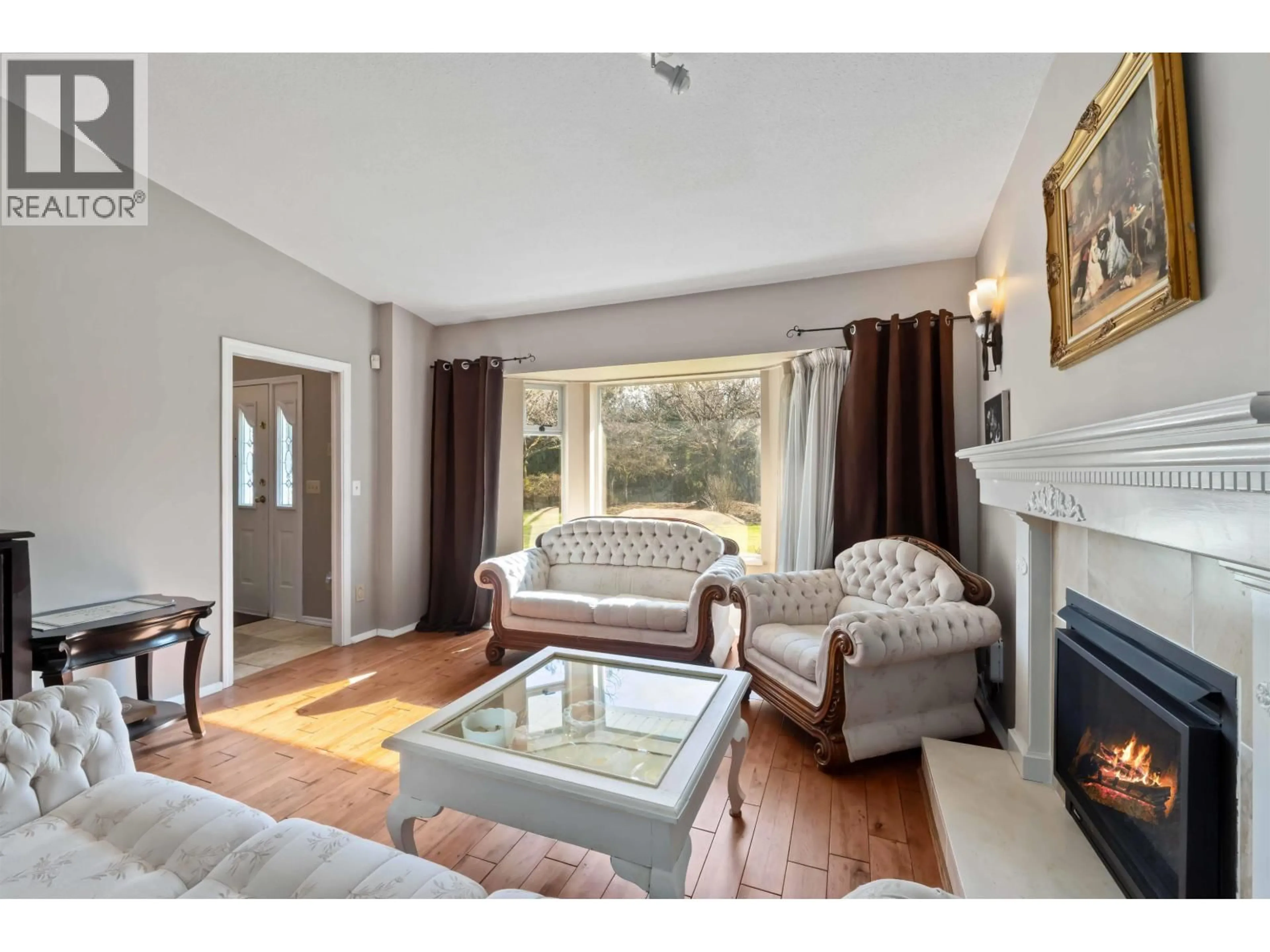 Living room with furniture, wood/laminate floor for 24109 124 AVENUE, Maple Ridge British Columbia V4R1N3