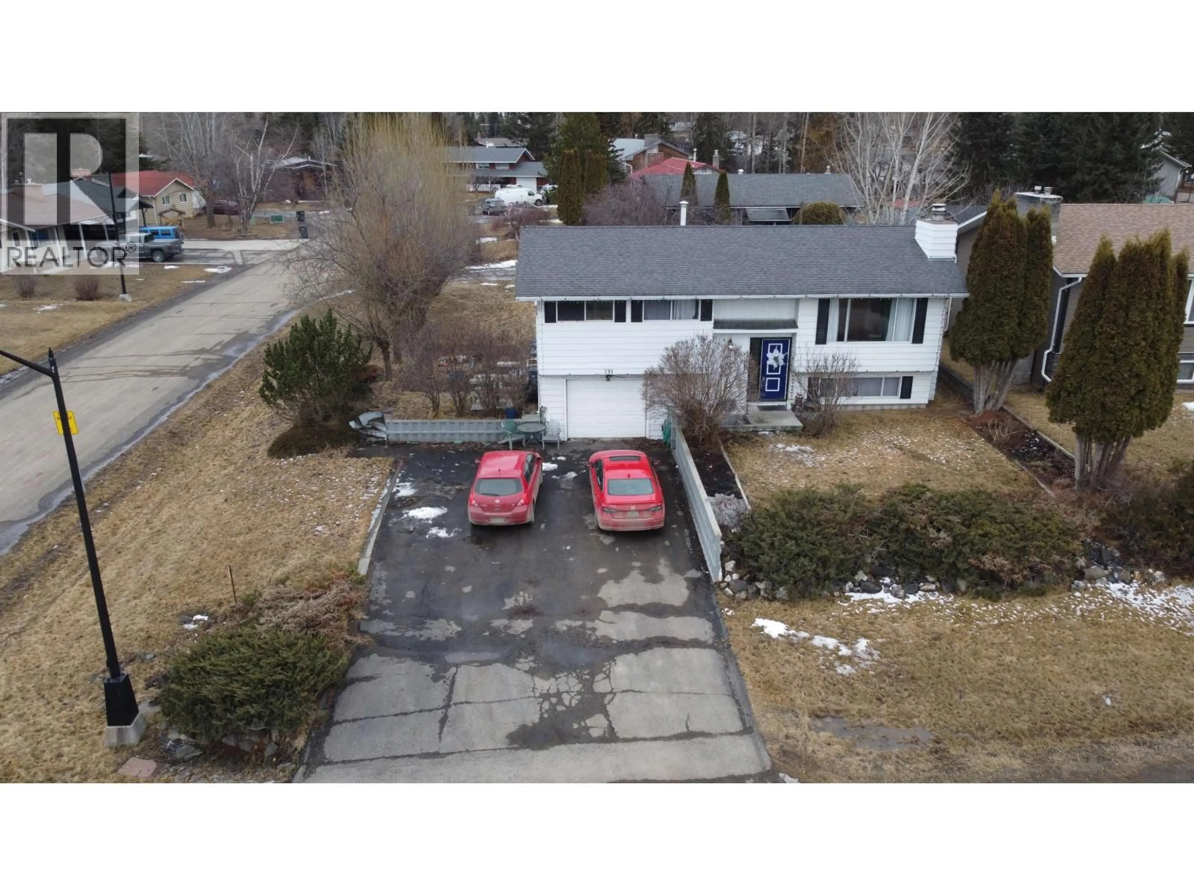 A pic from outside/outdoor area/front of a property/back of a property/a pic from drone, street for 391 BIRCH AVENUE, 100 Mile House British Columbia V0K2E0