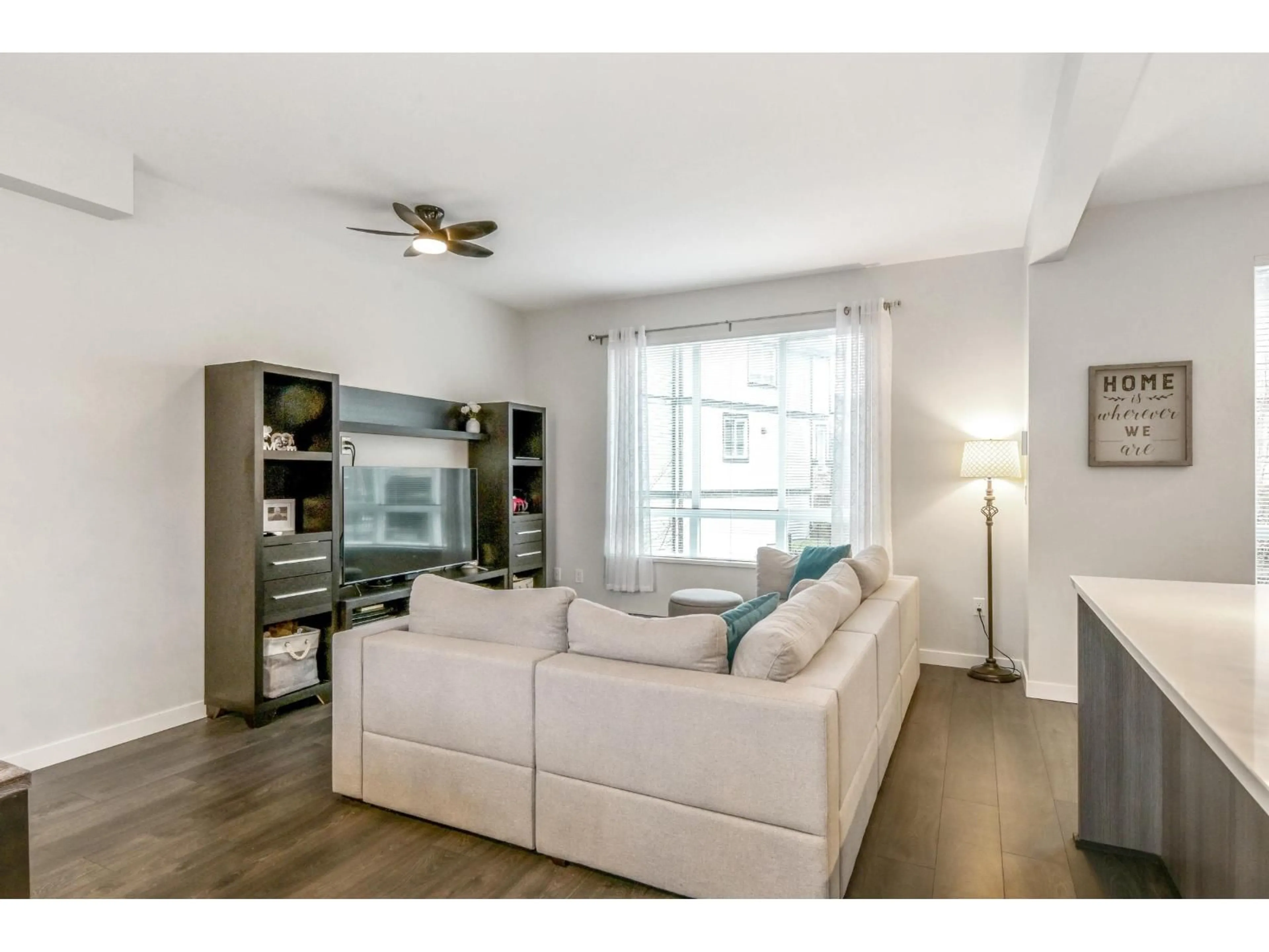 Living room with furniture, wood/laminate floor for 104 - 30930 WESTRIDGE PLACE, Abbotsford British Columbia V2T0G6
