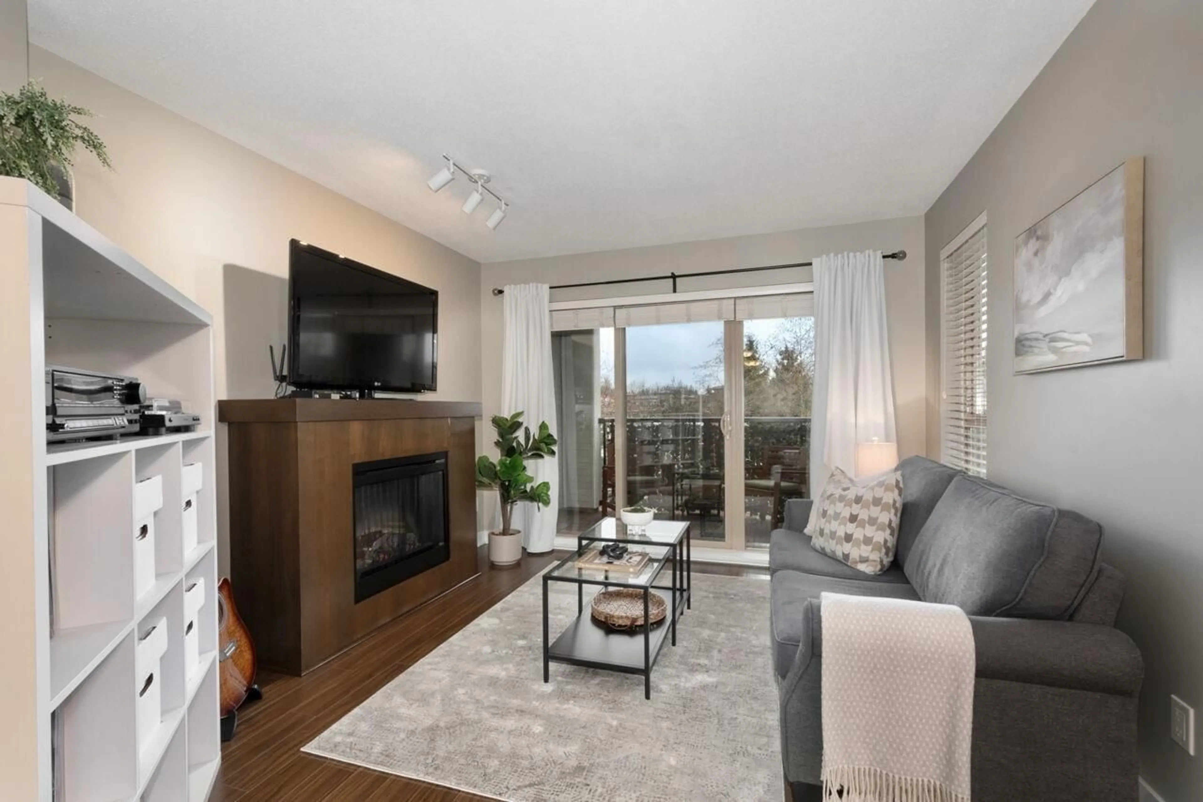 Living room with furniture, wood/laminate floor for D207 - 8929 202 STREET, Langley British Columbia V1M0B4