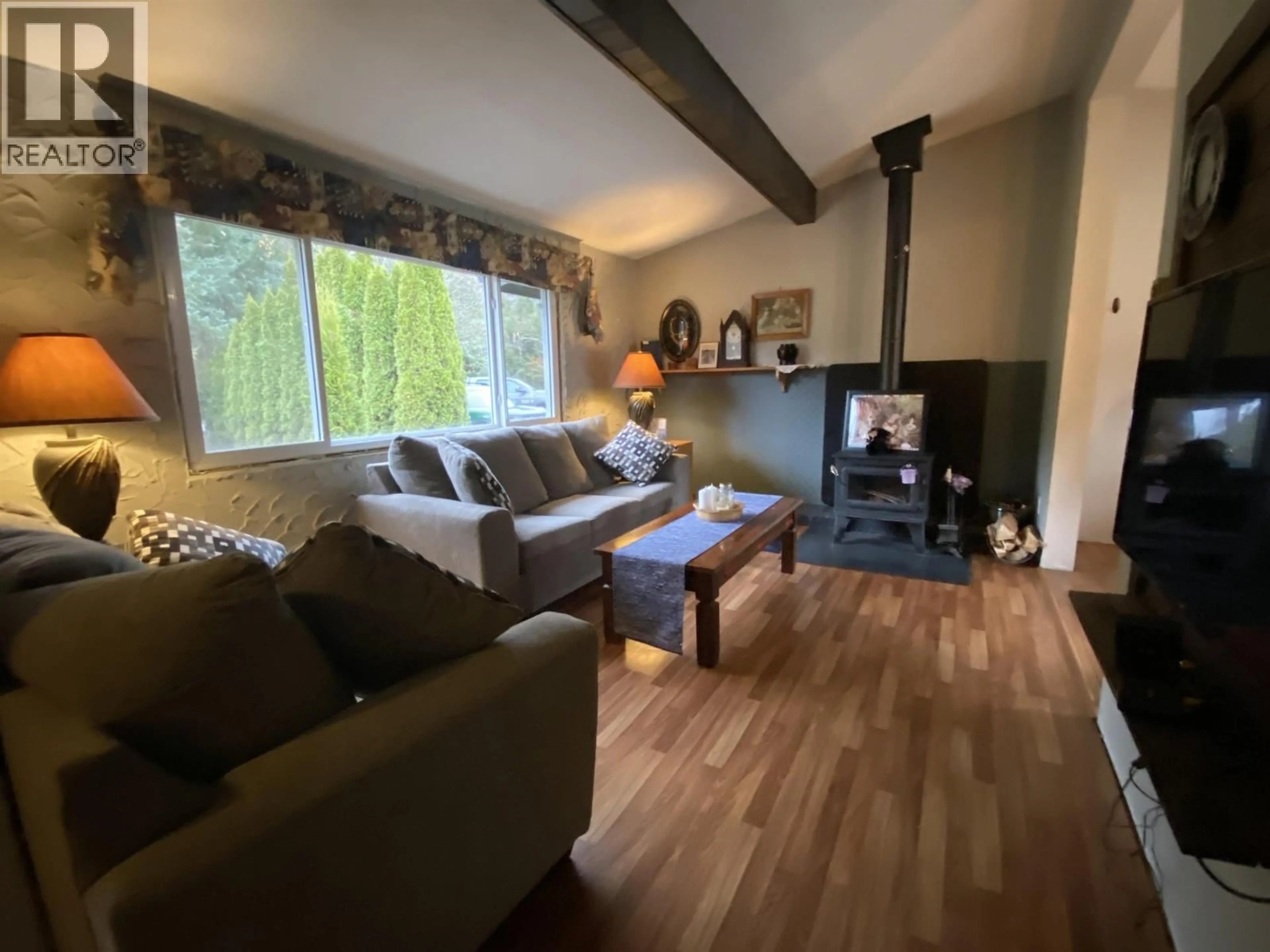 Living room with furniture, wood/laminate floor for 5203 GOSSEN CREEK STREET, Terrace British Columbia V8G0A6