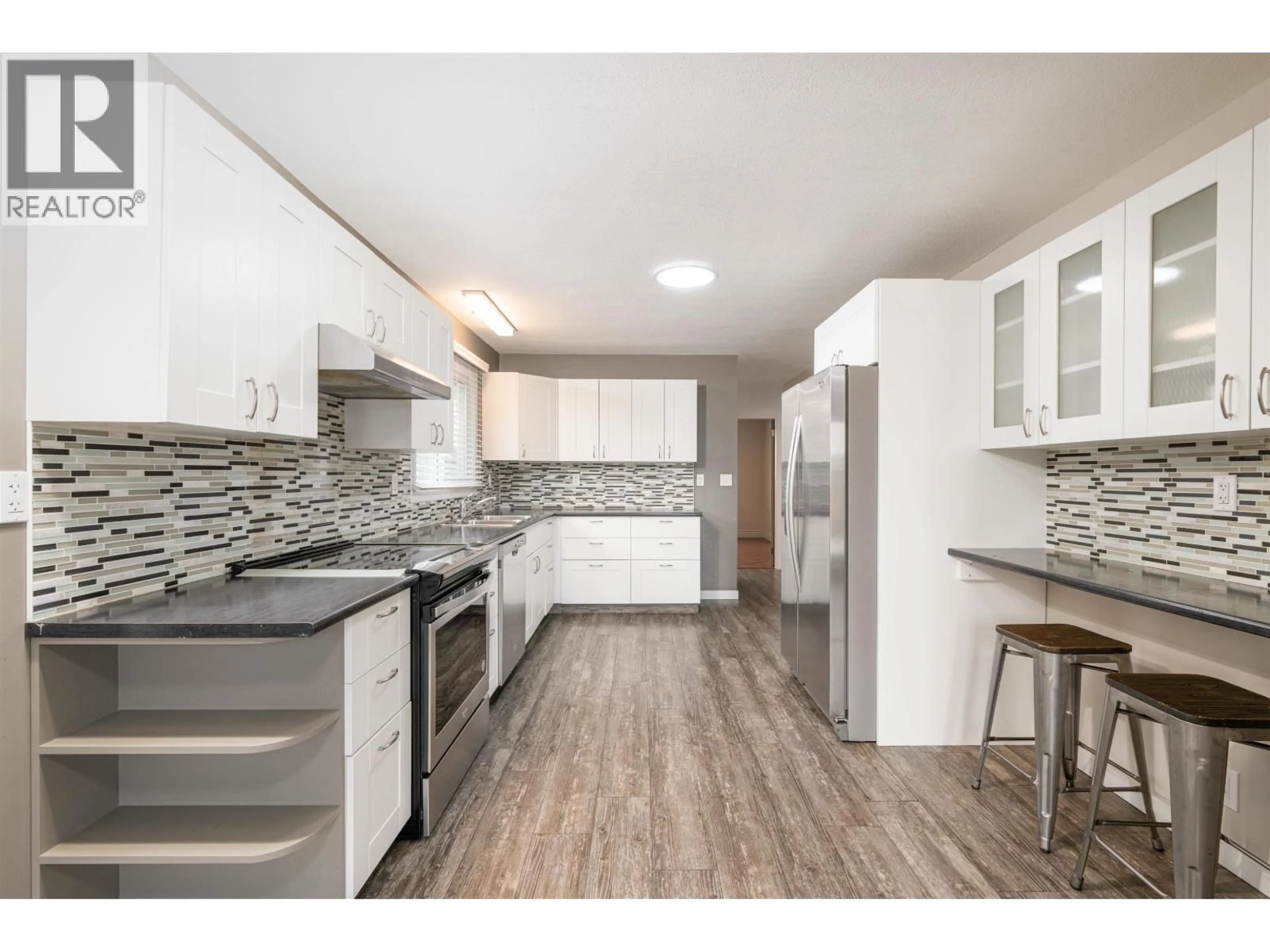 Open concept kitchen, wood/laminate floor for 290 KELLY STREET, Prince George British Columbia V2M3K3