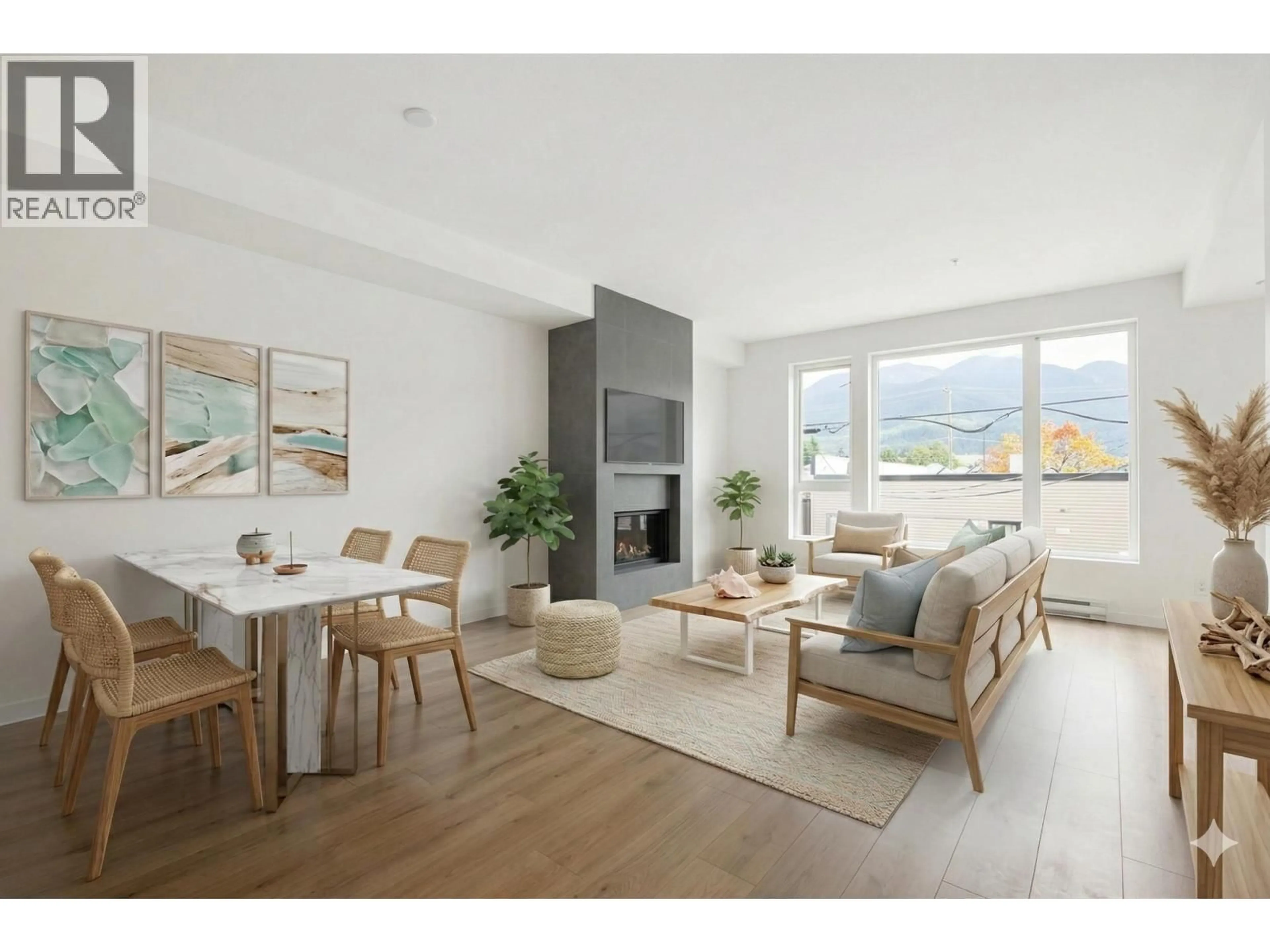 Living room with furniture, wood/laminate floor for 201 - 38165 CLEVELAND AVENUE, Squamish British Columbia V8P0P1