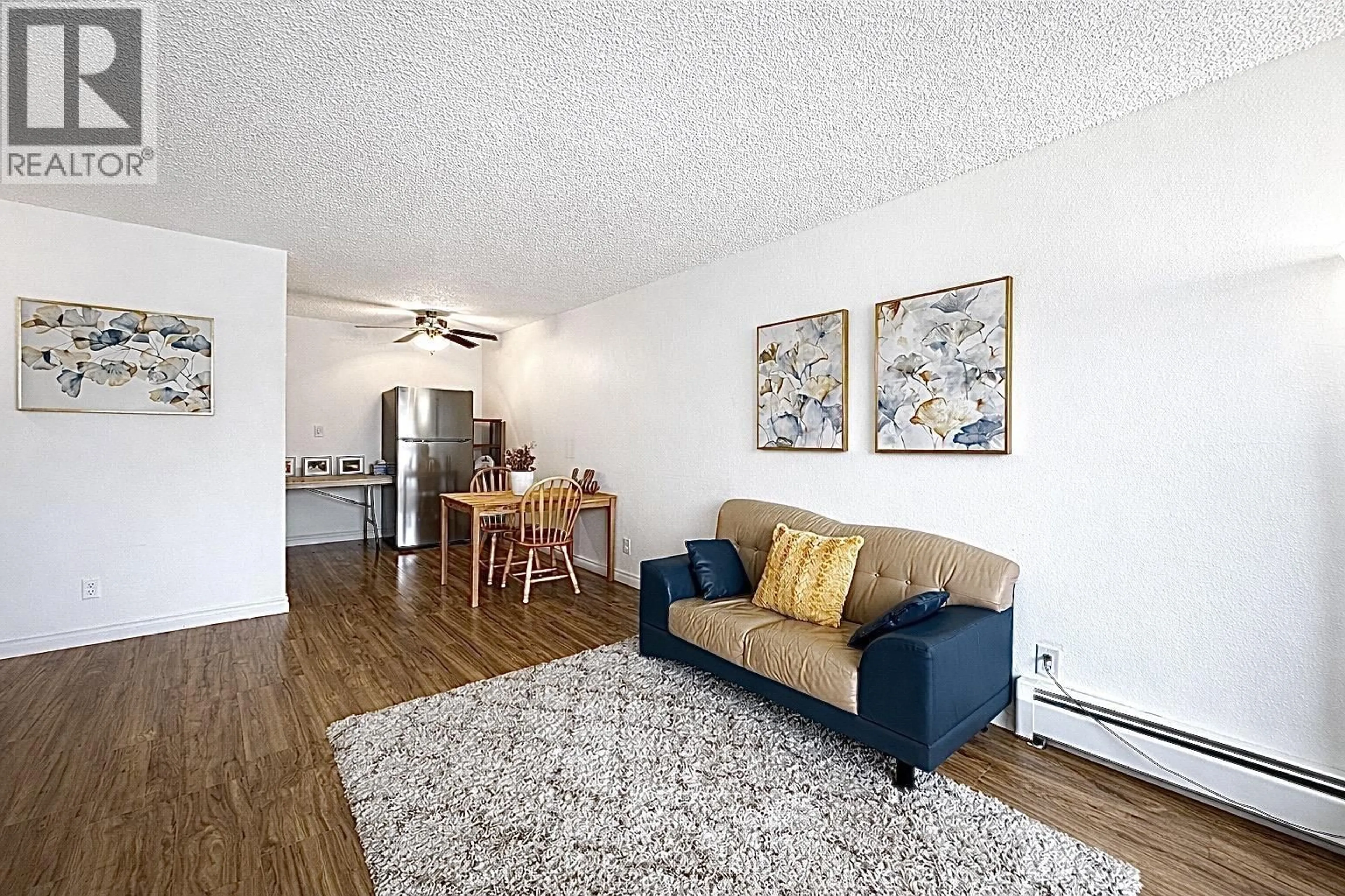 Living room with furniture, wood/laminate floor for 203 - 2425 SHAUGHNESSY STREET, Port Coquitlam British Columbia V3C3E6