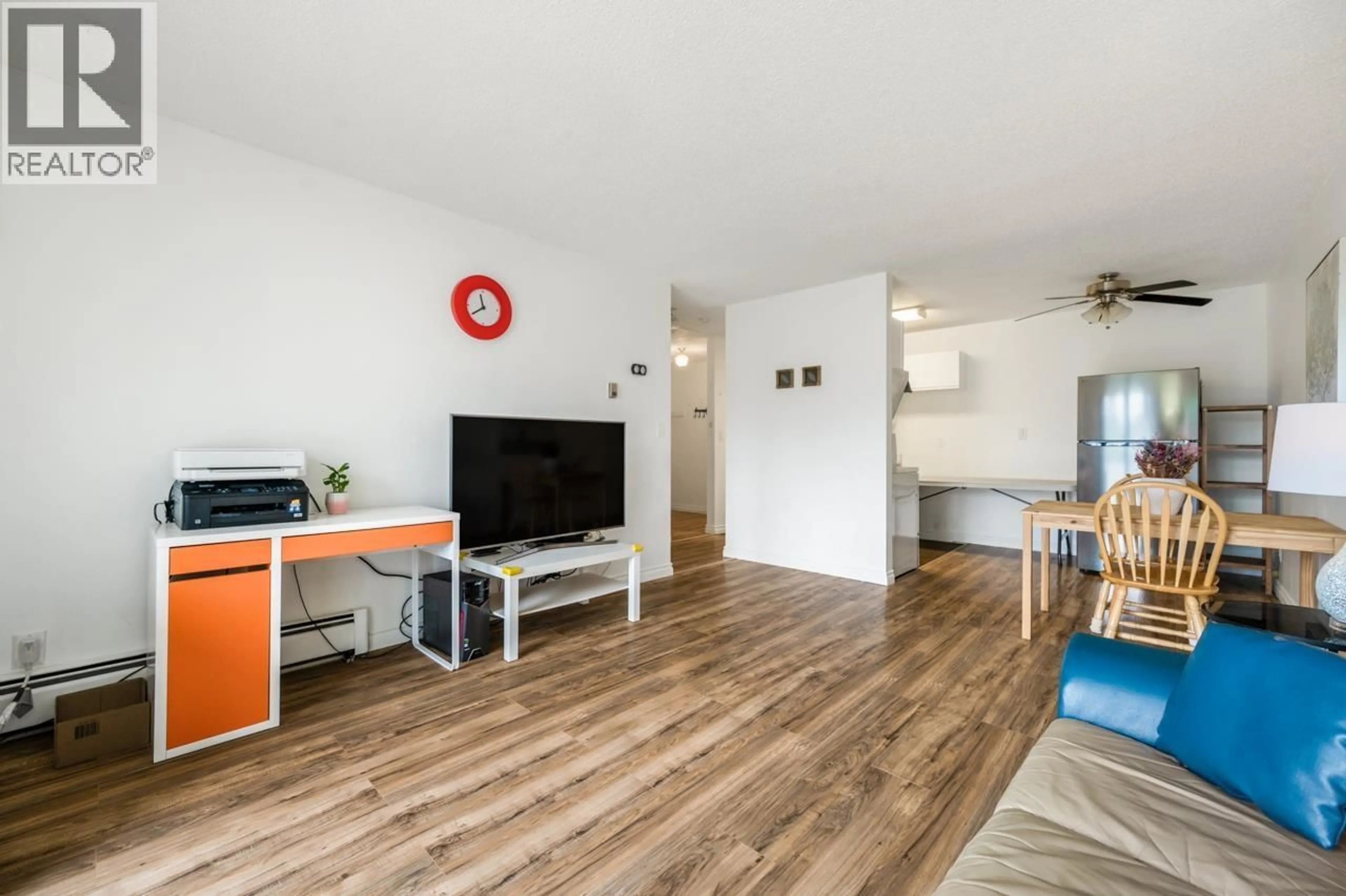 Living room with furniture, wood/laminate floor for 203 - 2425 SHAUGHNESSY STREET, Port Coquitlam British Columbia V3C3E6