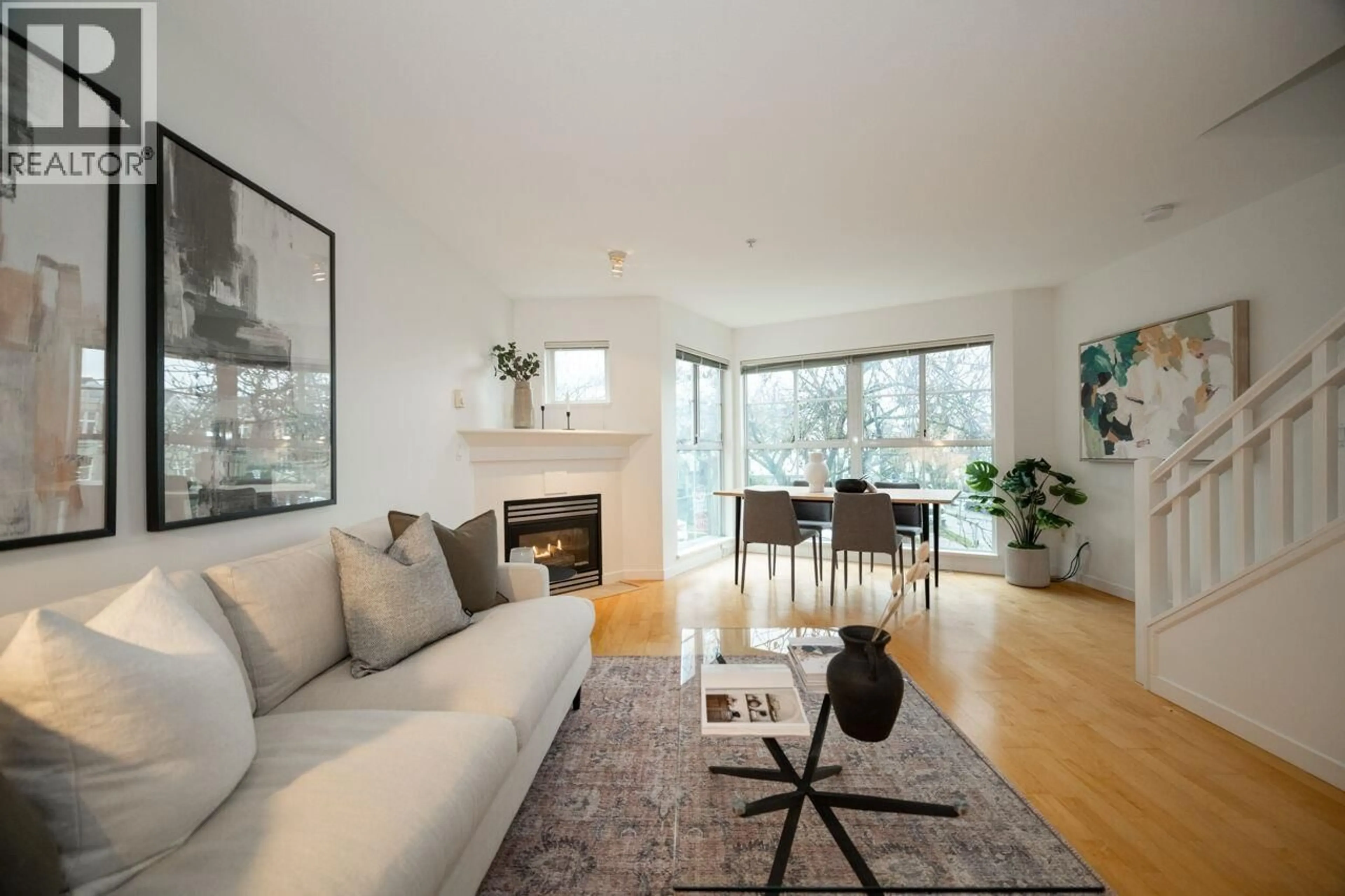 Living room with furniture, wood/laminate floor for 211 - 692 7TH AVENUE, Vancouver British Columbia V5Z1B5