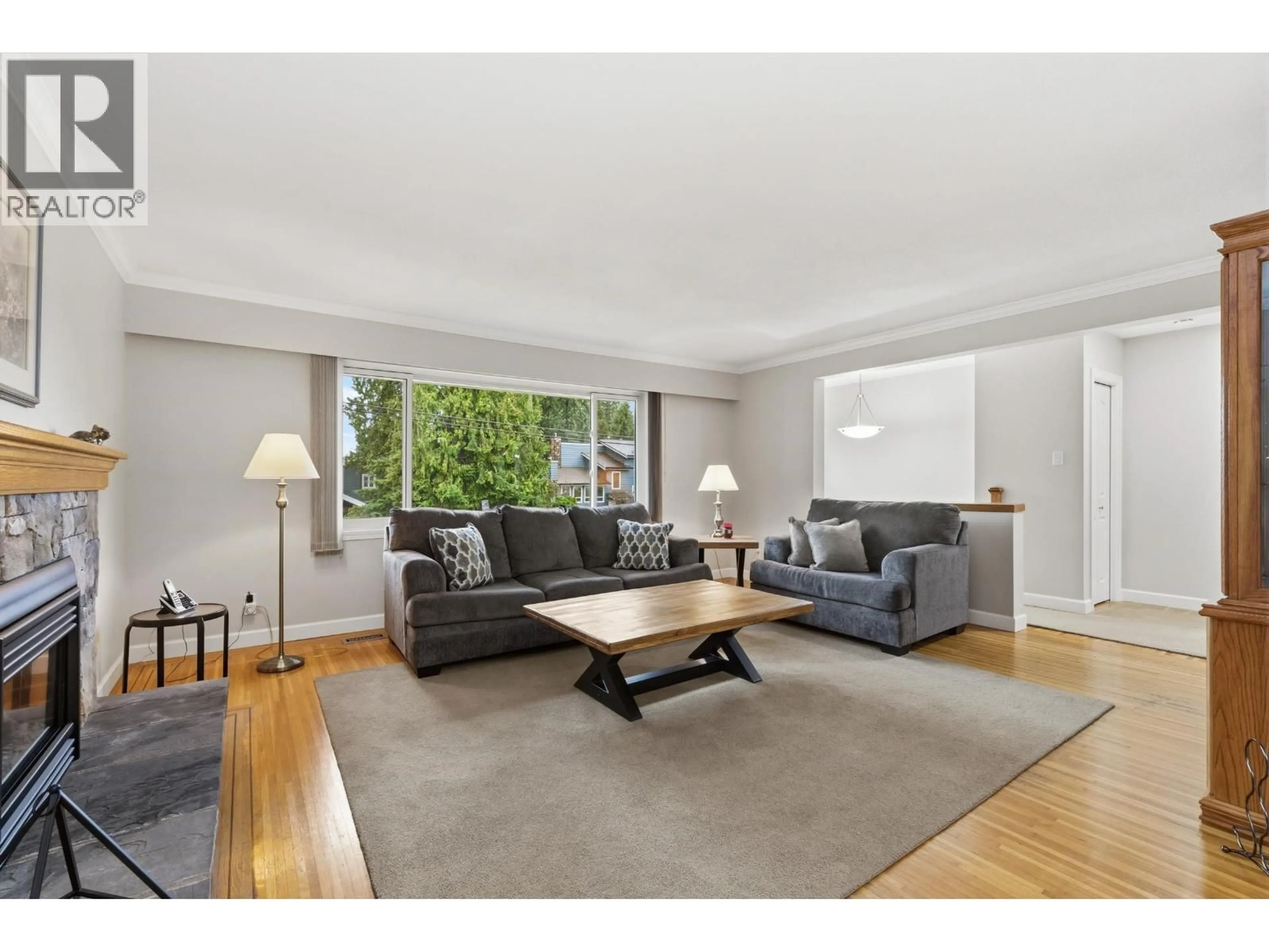 Living room with furniture, wood/laminate floor for 2497 TOLMIE AVENUE, Coquitlam British Columbia V3K3E6