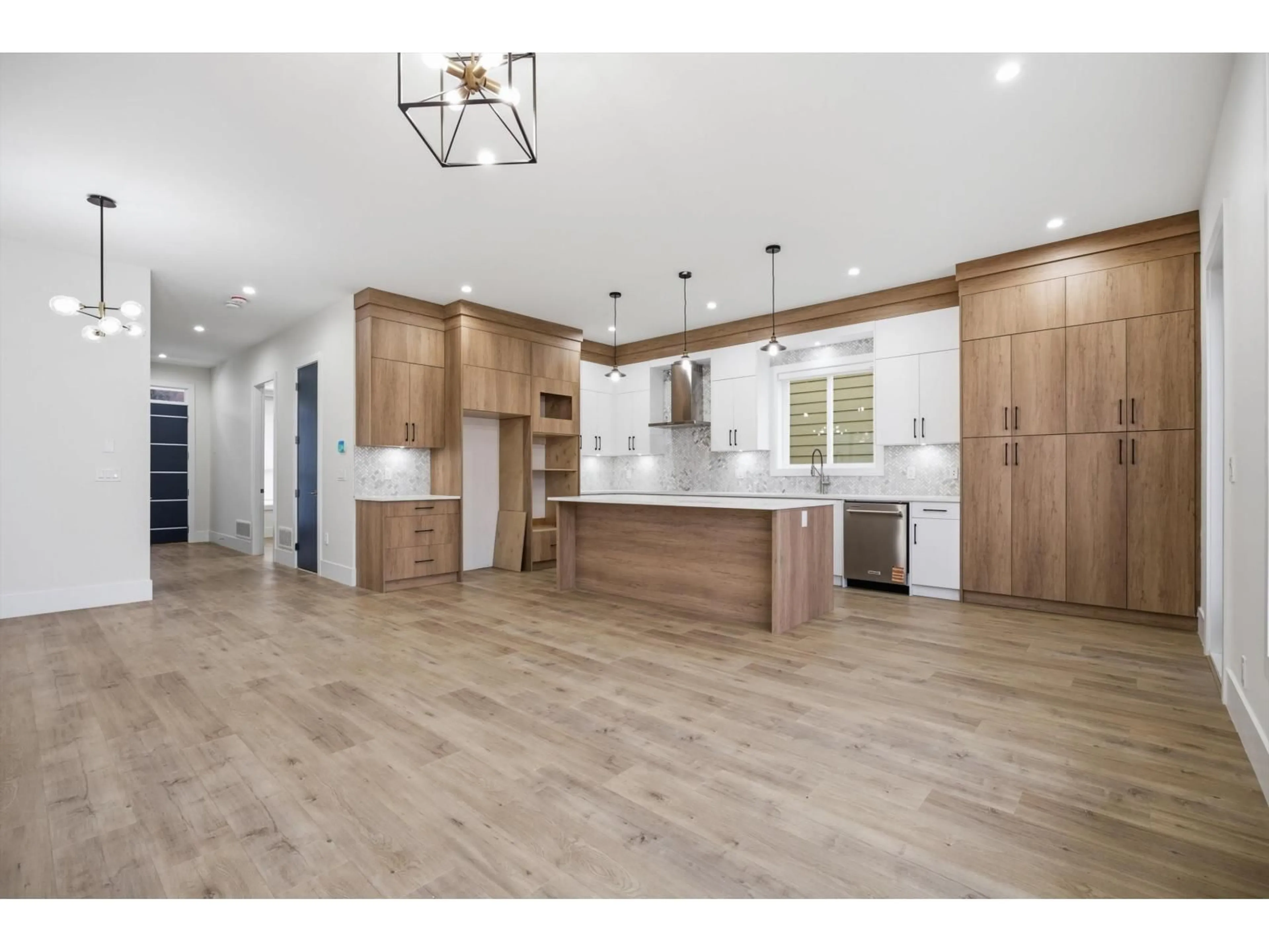 Open concept kitchen, wood/laminate floor for 17130 1 AVENUE, Surrey British Columbia V3Z9R2