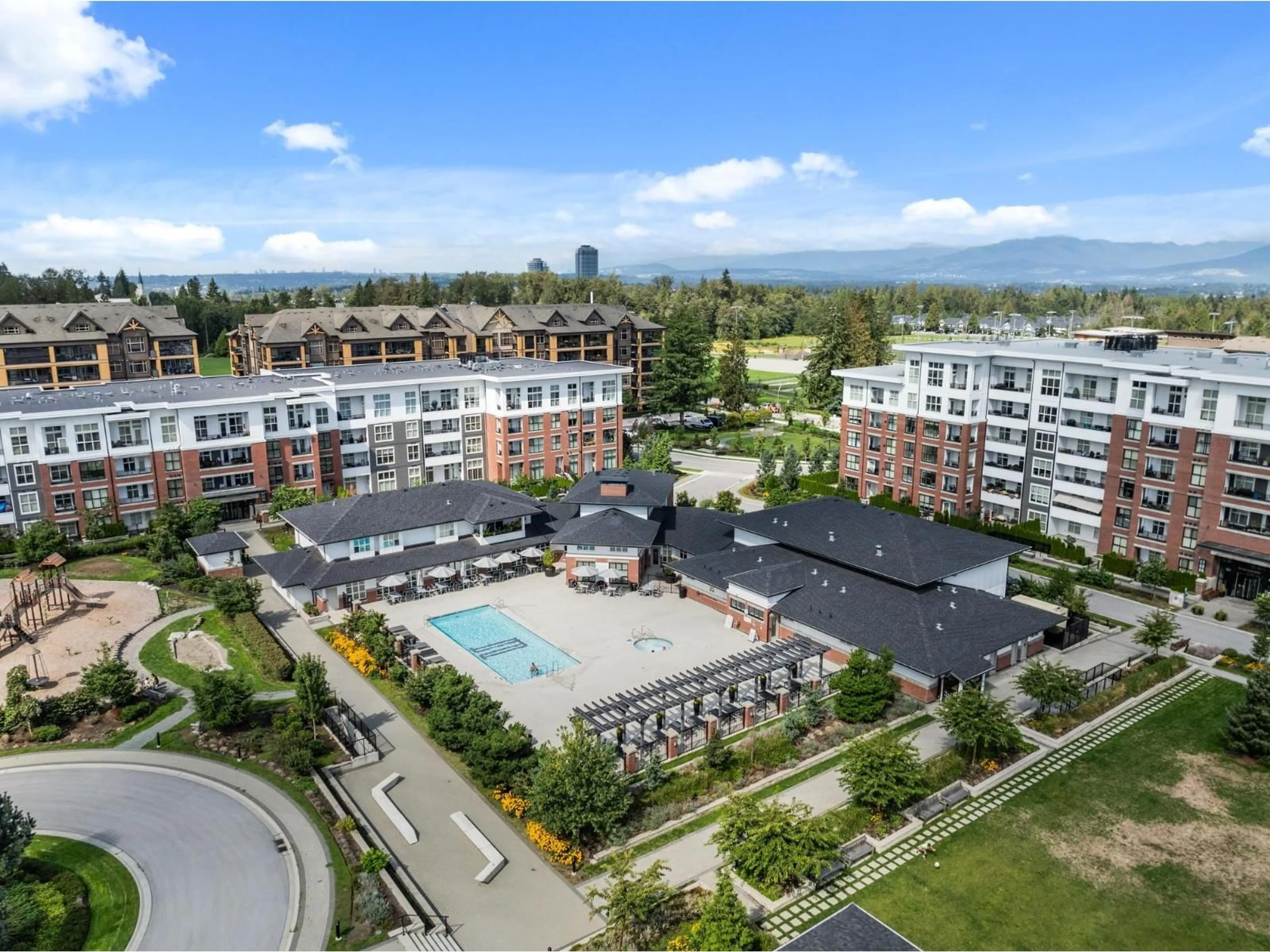 A pic from outside/outdoor area/front of a property/back of a property/a pic from drone, mountain view for C614 - 8150 207 STREET, Langley British Columbia V2Y4J4