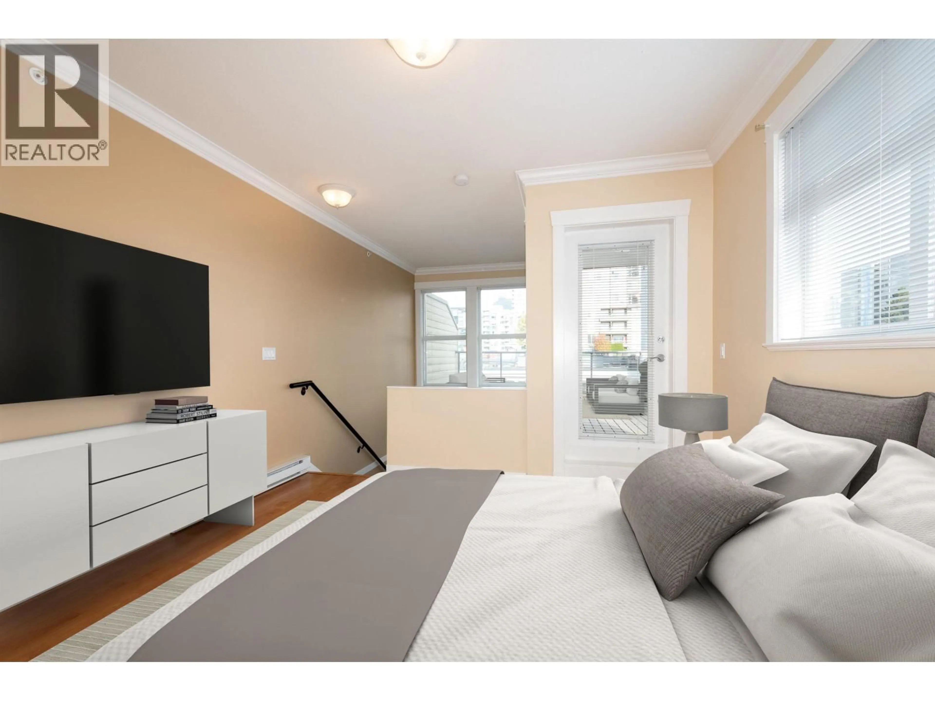 Bedroom with bed, wood/laminate floor for 304 - 152 12TH STREET, North Vancouver British Columbia V7L2J4