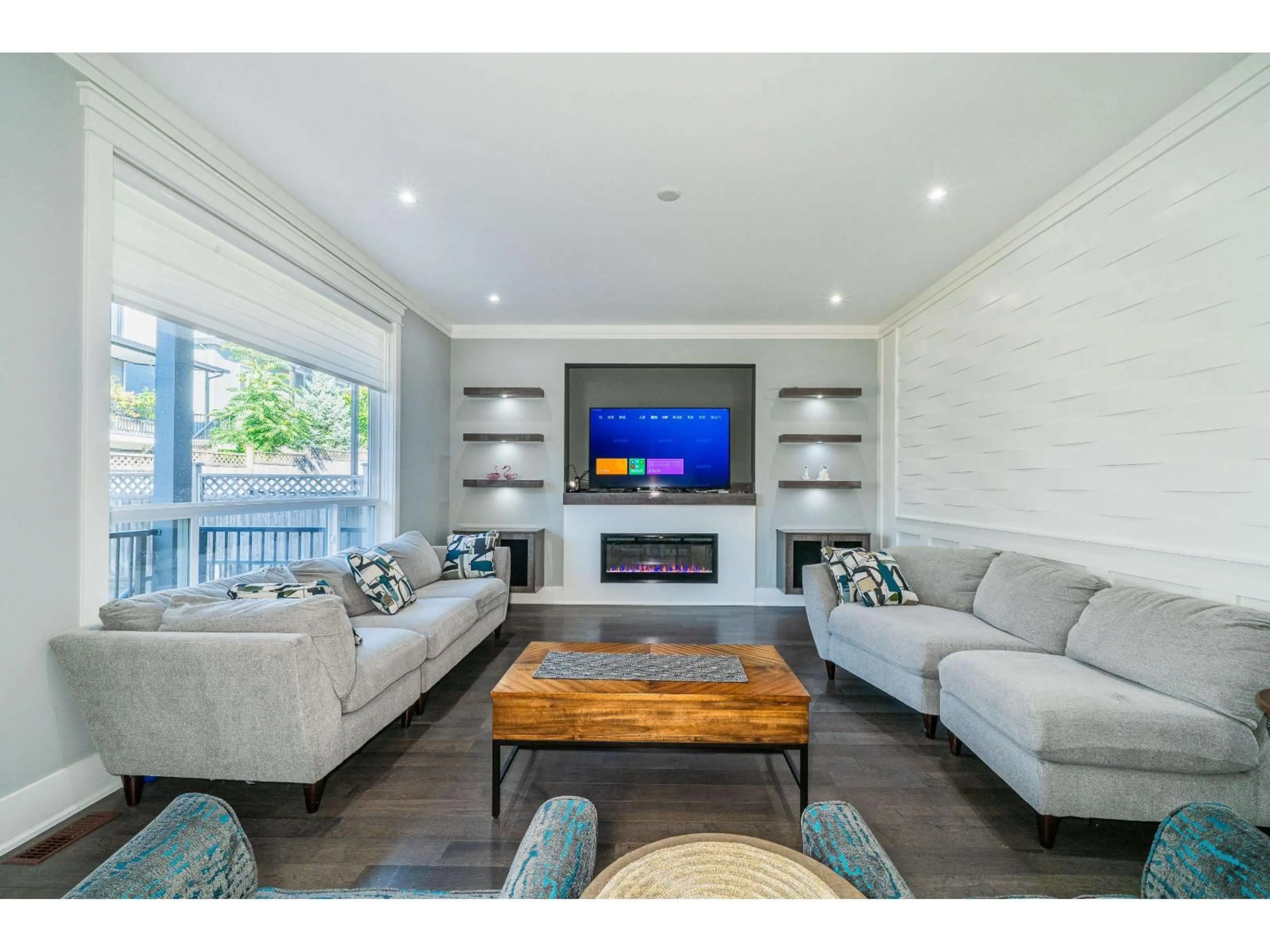 Living room with furniture, wood/laminate floor for 15441 76B AVENUE, Surrey British Columbia V3S1C2