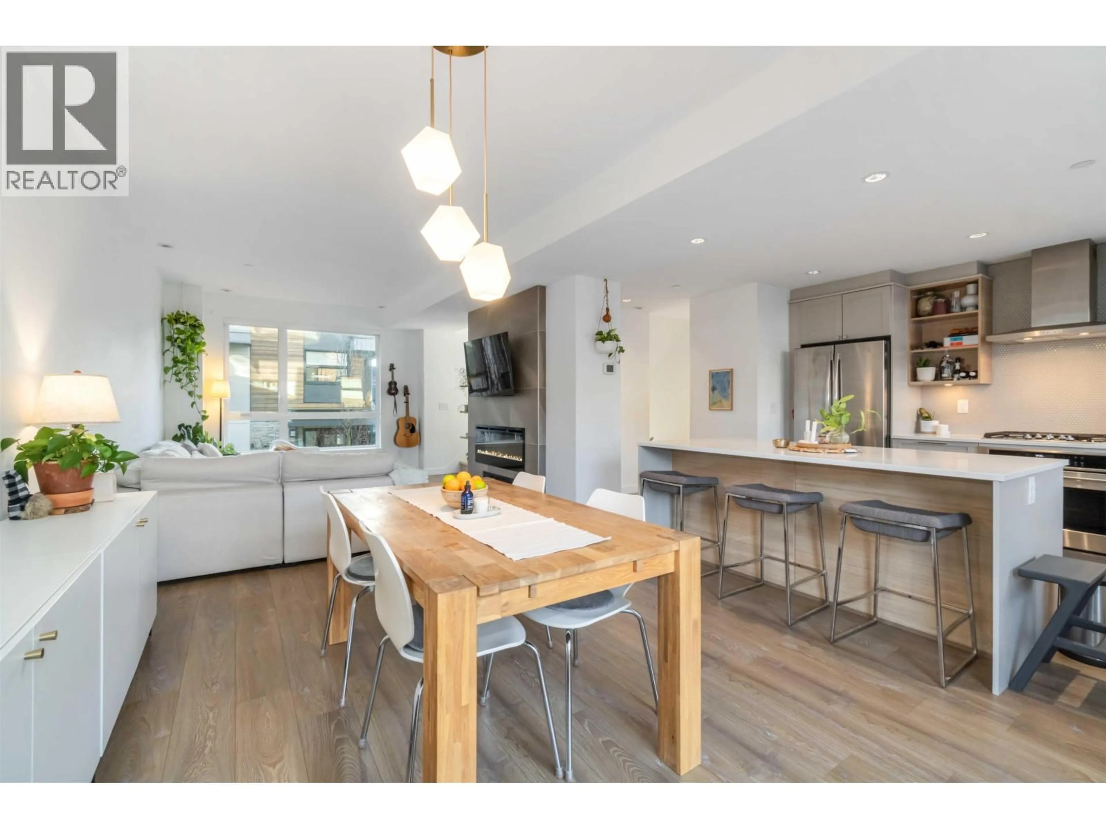 Open concept kitchen, wood/laminate floor for 8 - 856 ORWELL STREET, Vancouver British Columbia V7J2G3