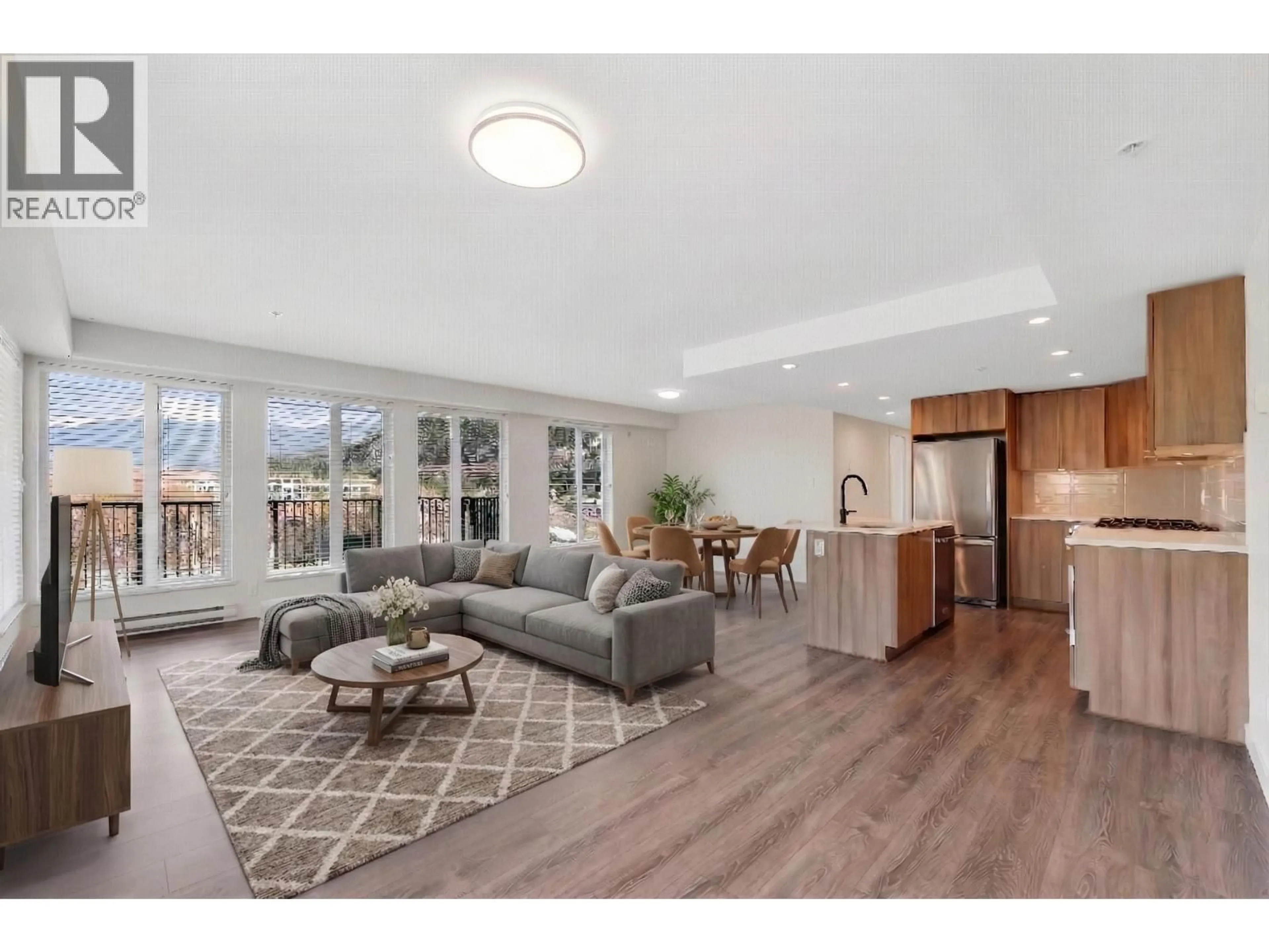 Living room with furniture, wood/laminate floor for 511 - 1365 PEMBERTON AVENUE, Squamish British Columbia V8B1B7