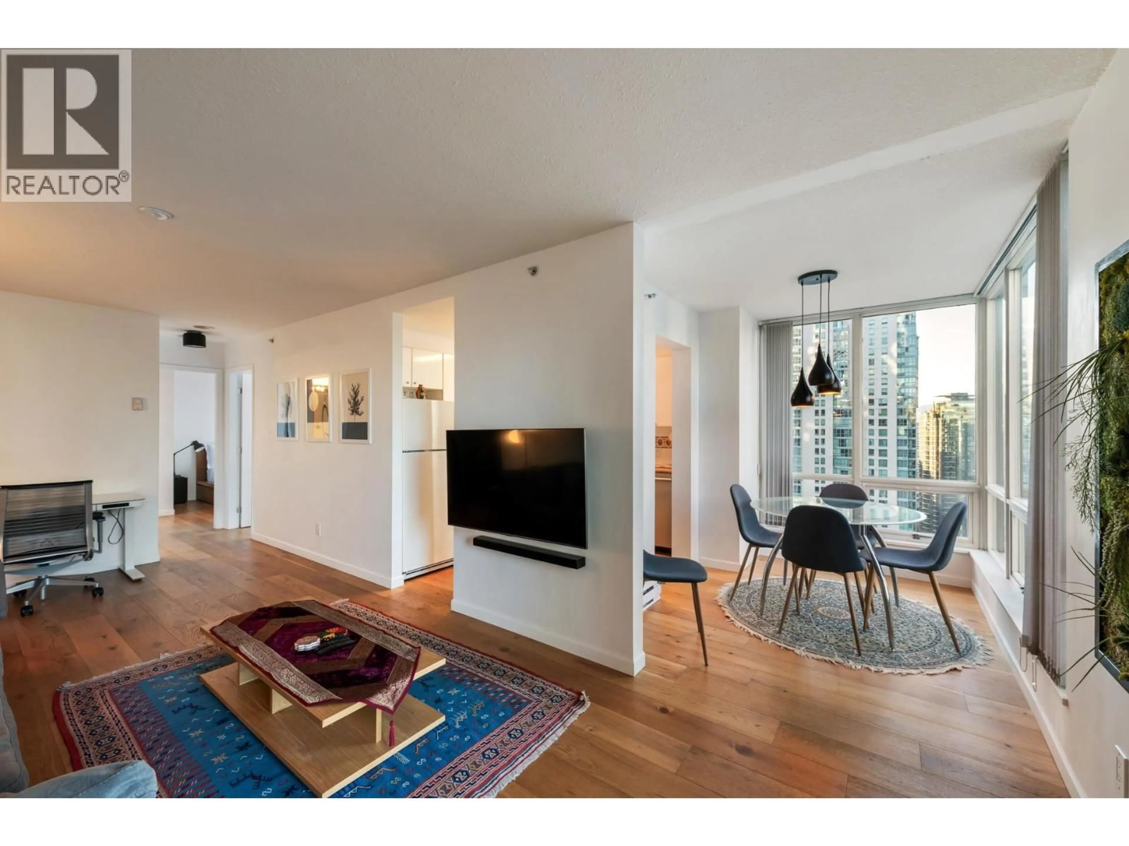 Living room with furniture, wood/laminate floor for 2103 - 1166 MELVILLE STREET, Vancouver British Columbia V6E4P5