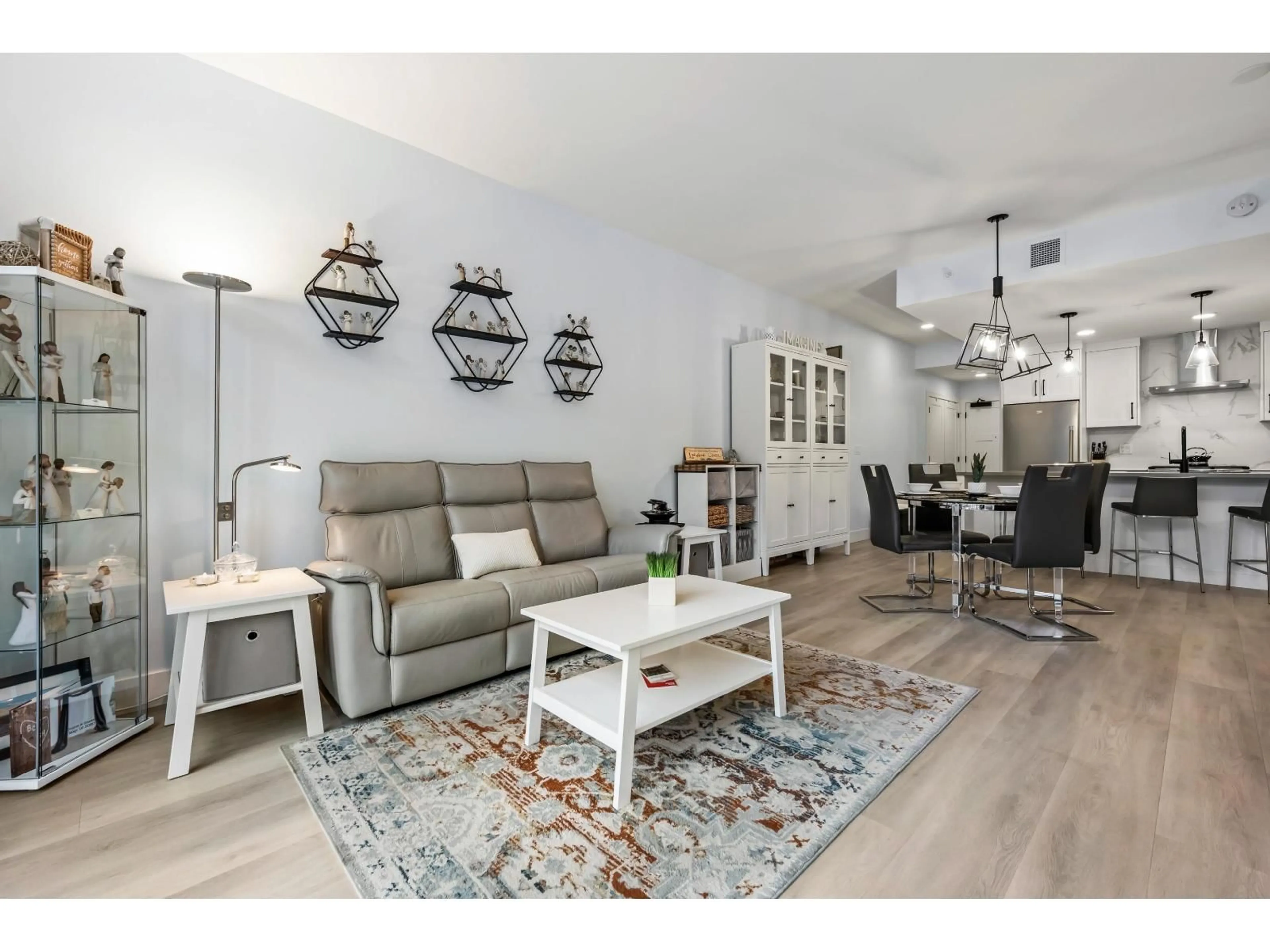 Living room with furniture, wood/laminate floor for 608 - 120 ESPLANADE AVENUE, Harrison Hot Springs British Columbia V0M1K0