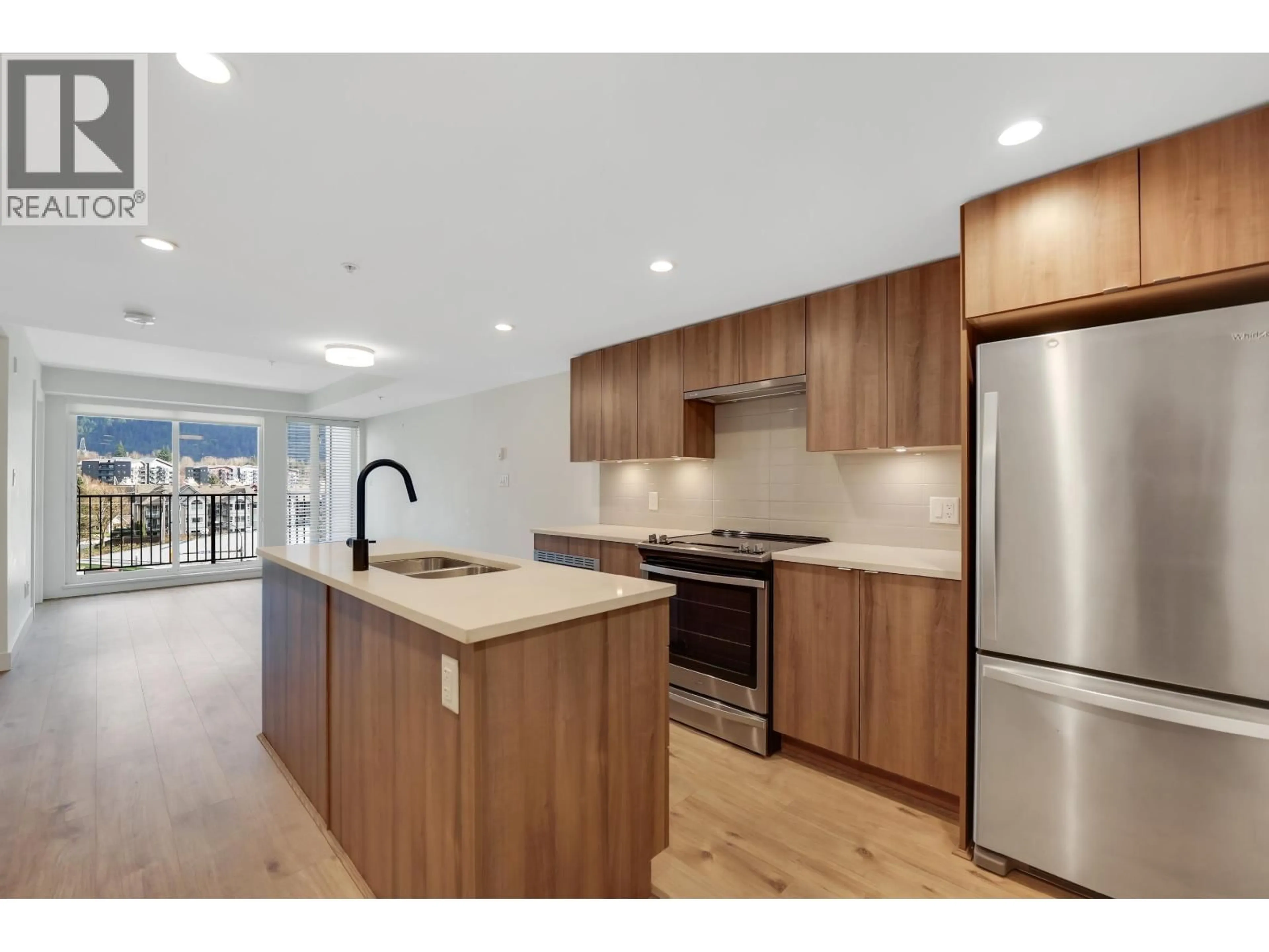 Open concept kitchen, unknown for 414 - 1365 PEMBERTON AVENUE, Squamish British Columbia V8B1B7