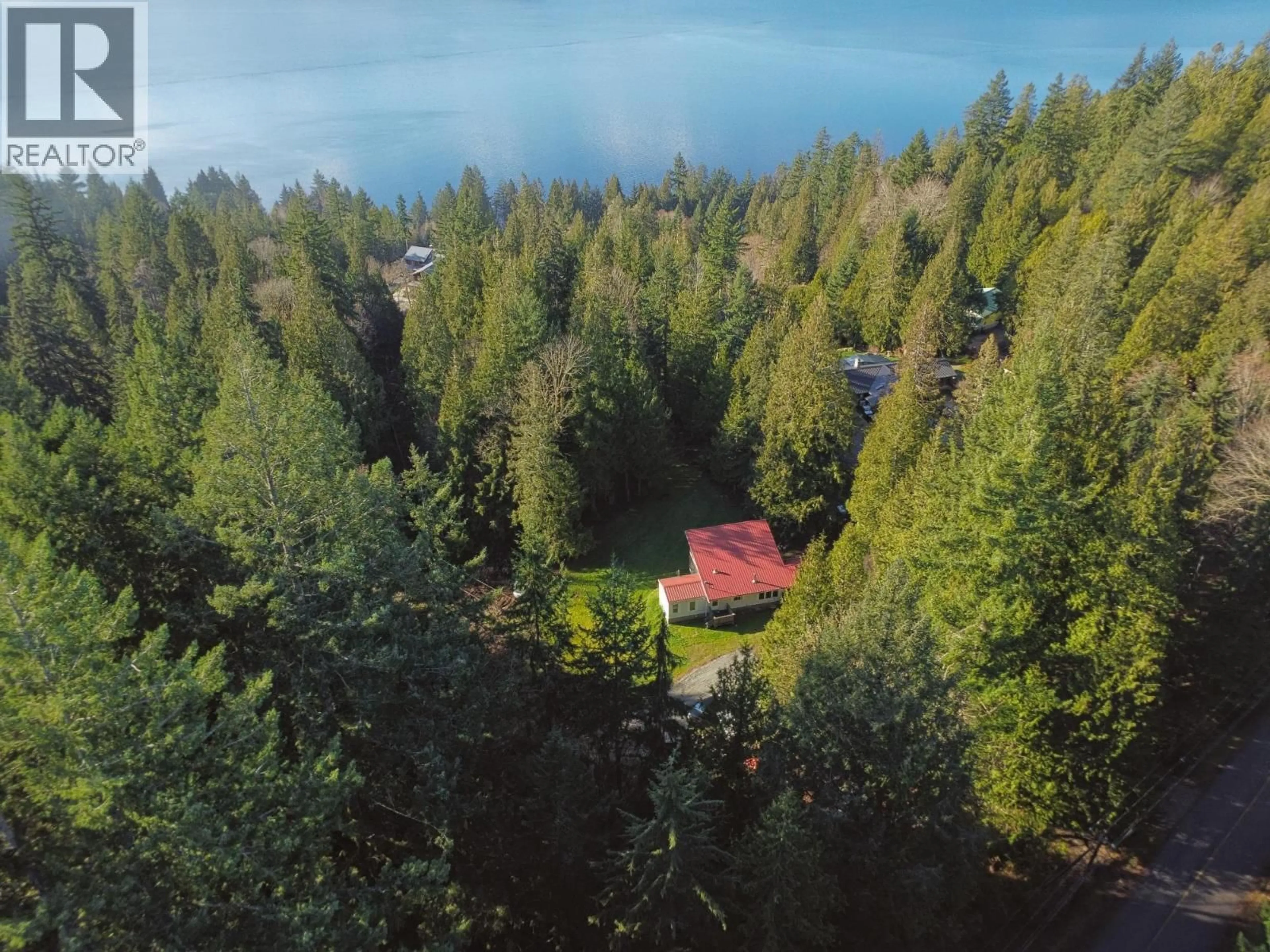 A pic from outside/outdoor area/front of a property/back of a property/a pic from drone, forest/trees view for 7103 SECHELT INLET ROAD, Sechelt British Columbia V7Z0P1