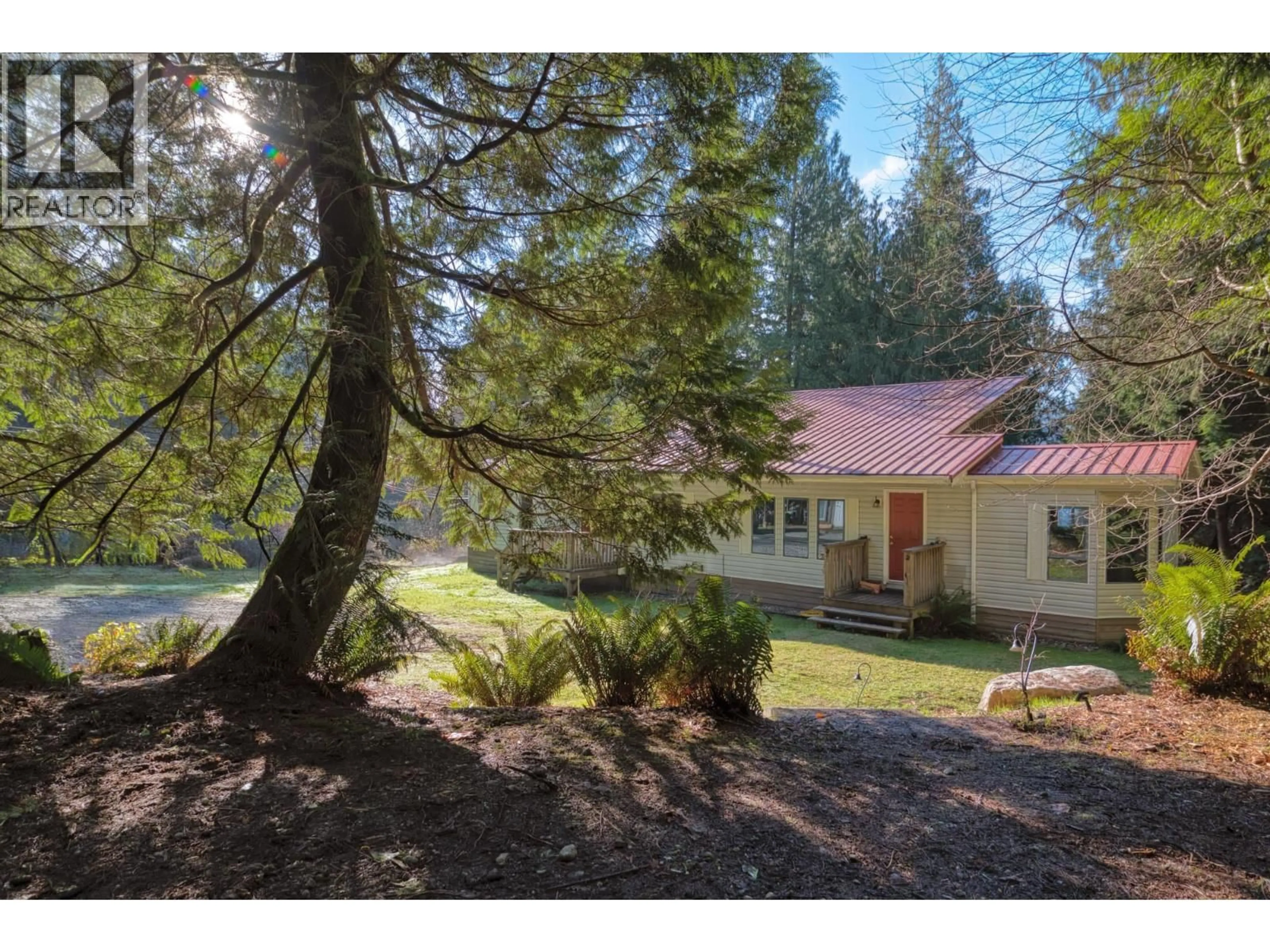 A pic from outside/outdoor area/front of a property/back of a property/a pic from drone, forest/trees view for 7103 SECHELT INLET ROAD, Sechelt British Columbia V7Z0P1