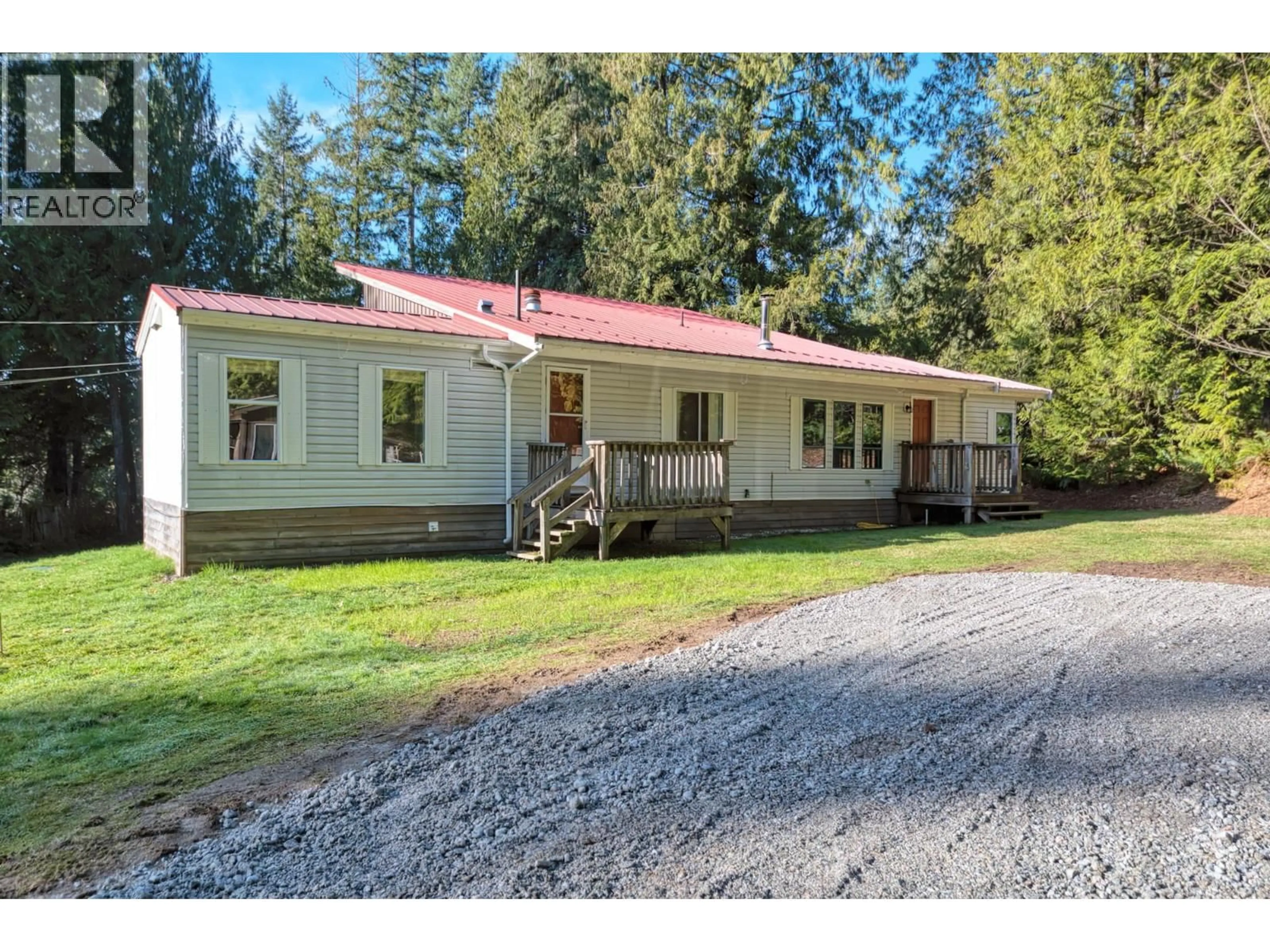 A pic from outside/outdoor area/front of a property/back of a property/a pic from drone, street for 7103 SECHELT INLET ROAD, Sechelt British Columbia V7Z0P1