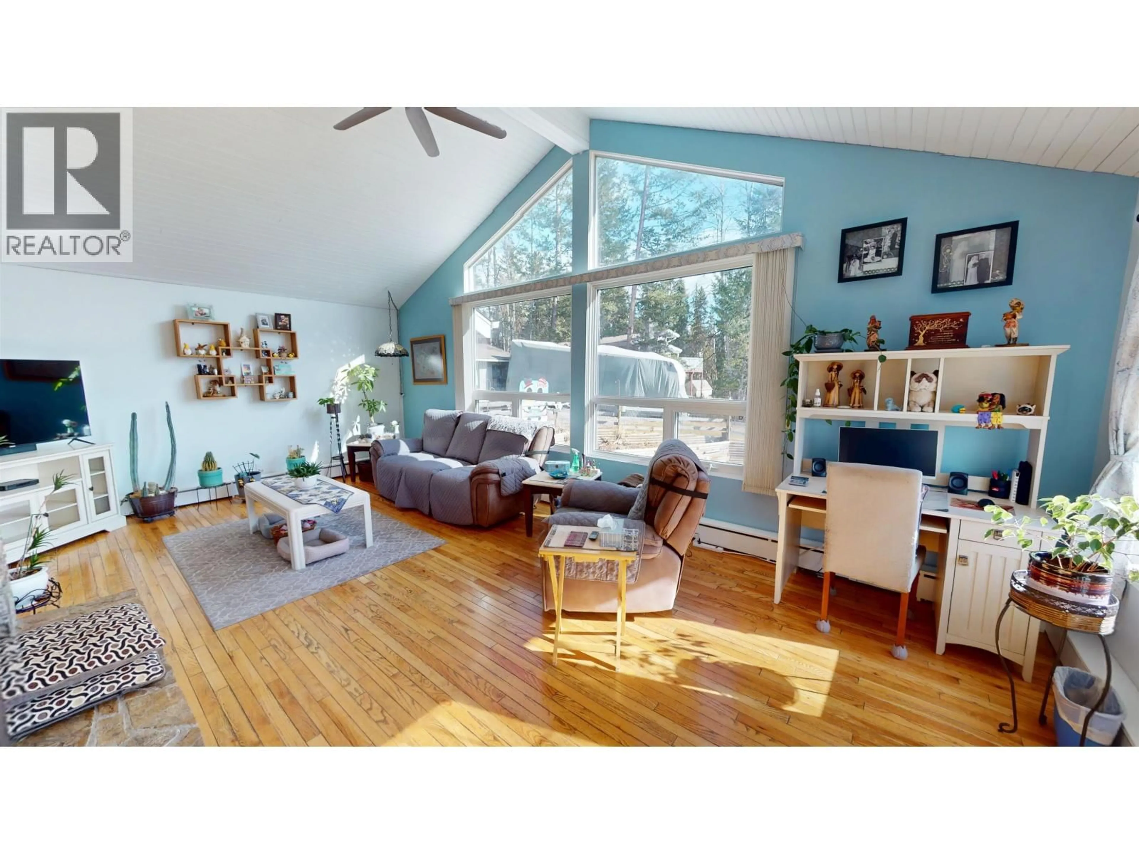 Living room with furniture, wood/laminate floor for 3286 SPRUCE RIDGE ROAD, Quesnel British Columbia V2J4R4