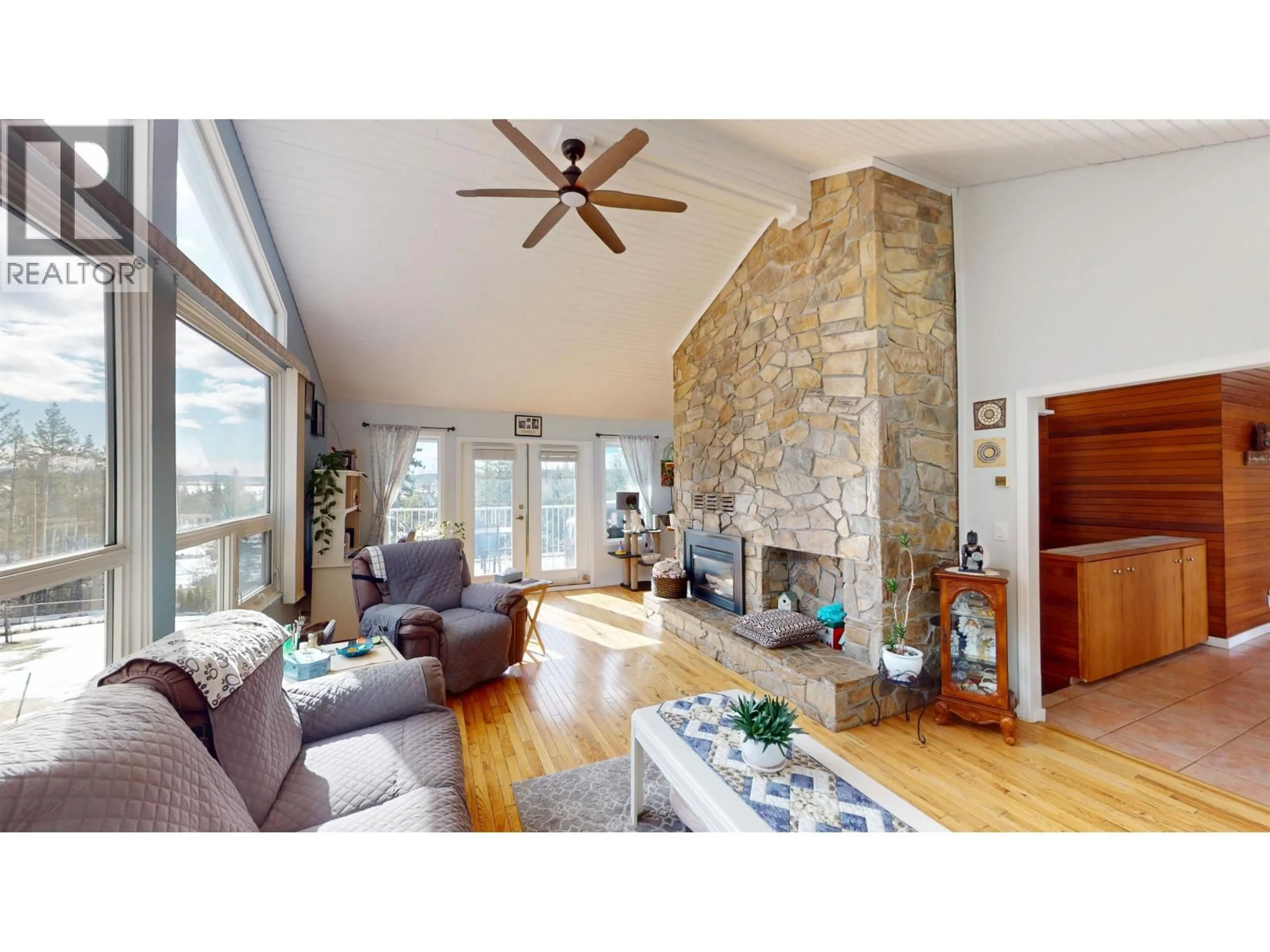 Living room with furniture, wood/laminate floor for 3286 SPRUCE RIDGE ROAD, Quesnel British Columbia V2J4R4