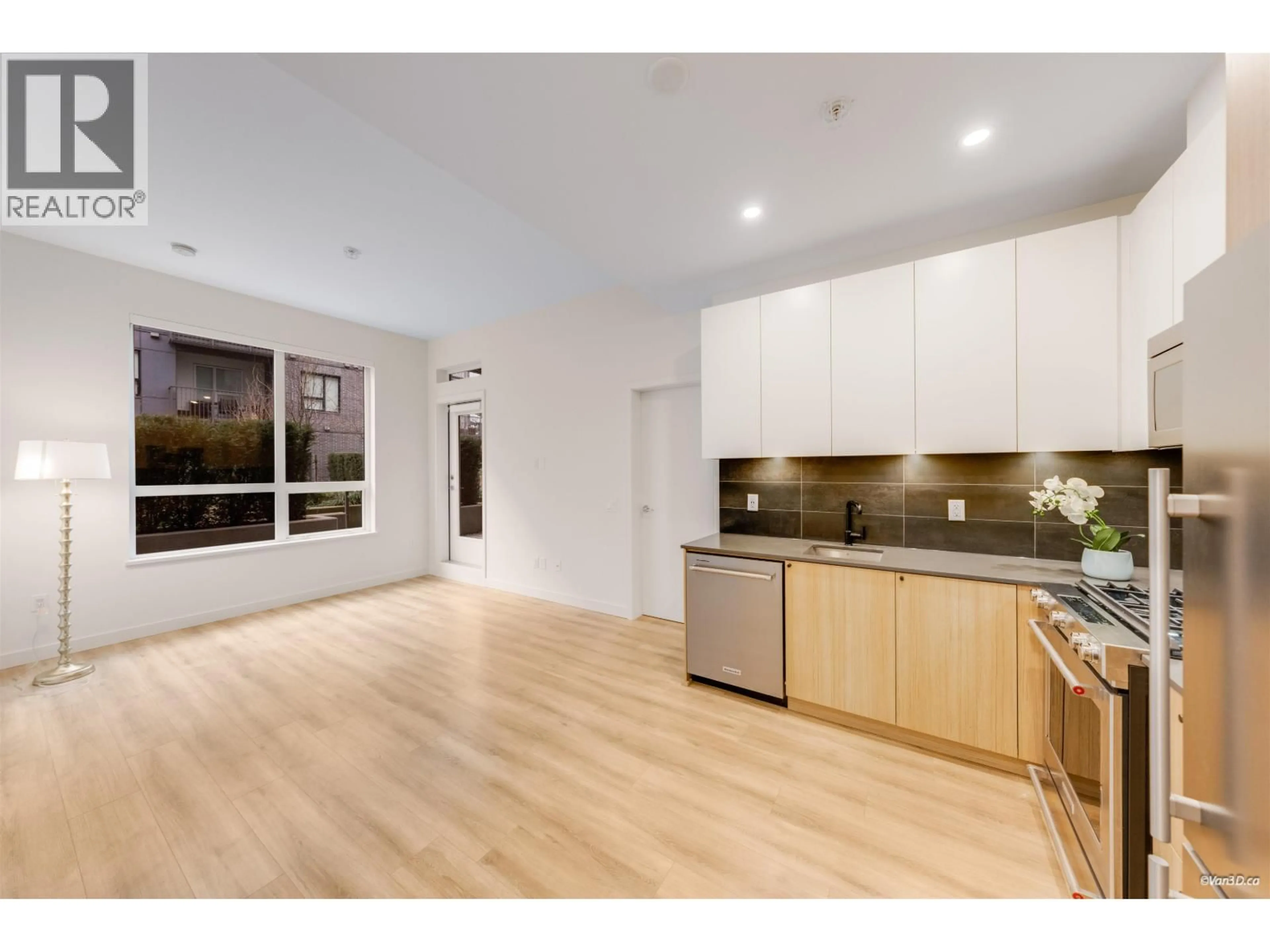 Open concept kitchen, wood/laminate floor for 102 - 645 COMO LAKE AVENUE, Coquitlam British Columbia V3J0N9