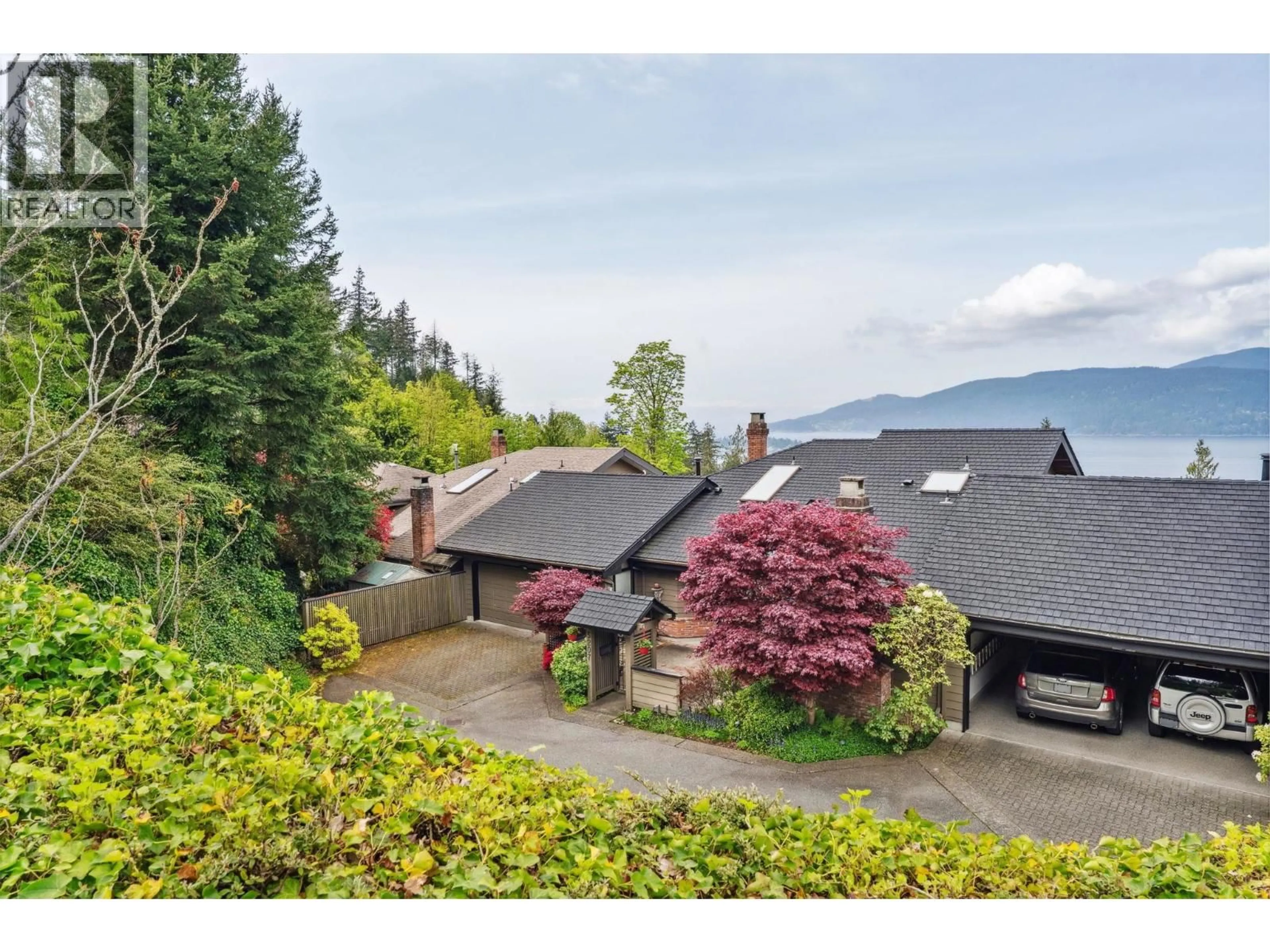 A pic from outside/outdoor area/front of a property/back of a property/a pic from drone, mountain view for 5207 ASPEN DRIVE, West Vancouver British Columbia V7W2Z7