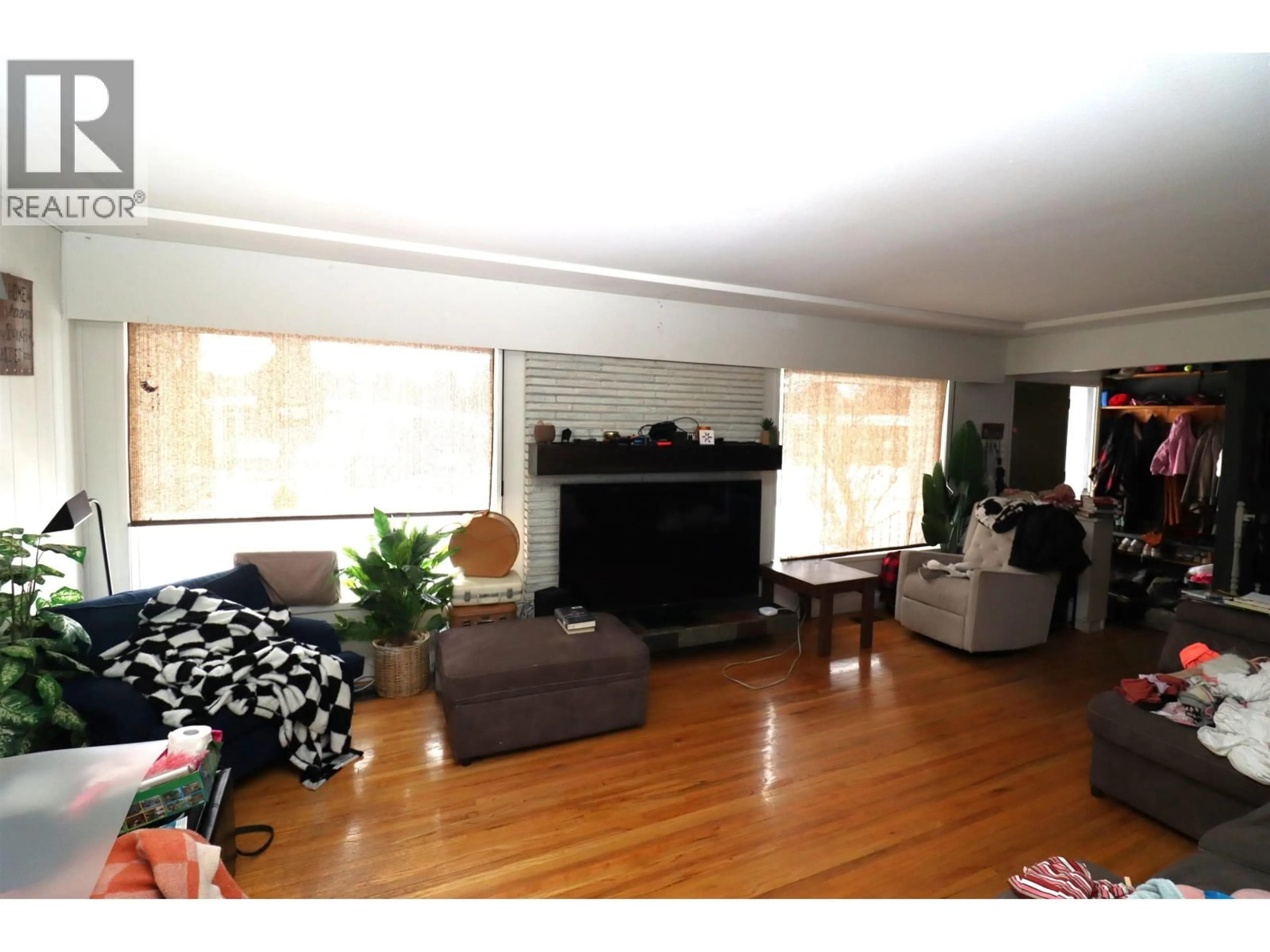 Living room with furniture, wood/laminate floor for 153 GILLETT STREET, Prince George British Columbia V2M2T1