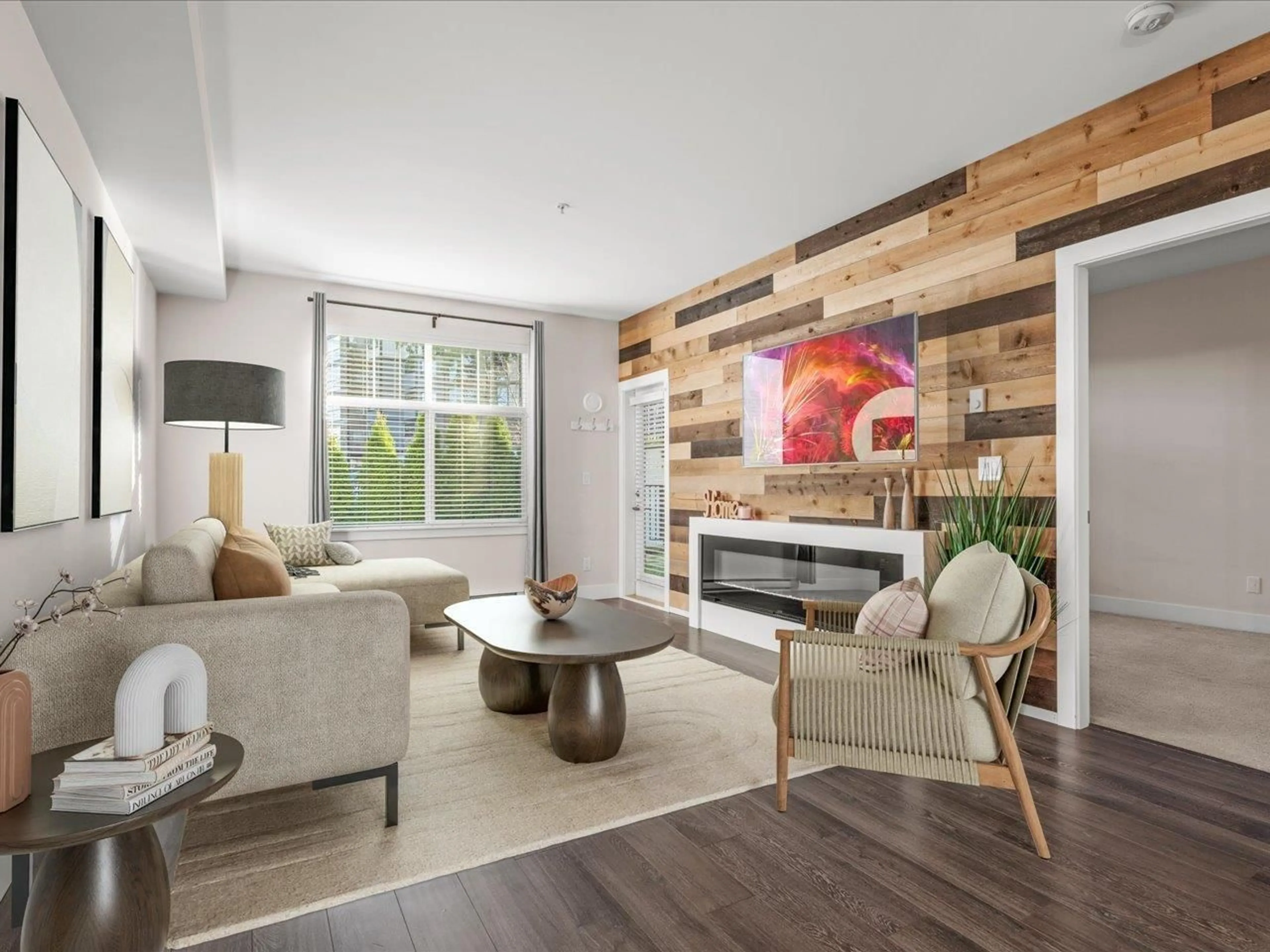 Living room with furniture, wood/laminate floor for 101 - 14605 MCDOUGALL DRIVE, Surrey British Columbia V4P0G7