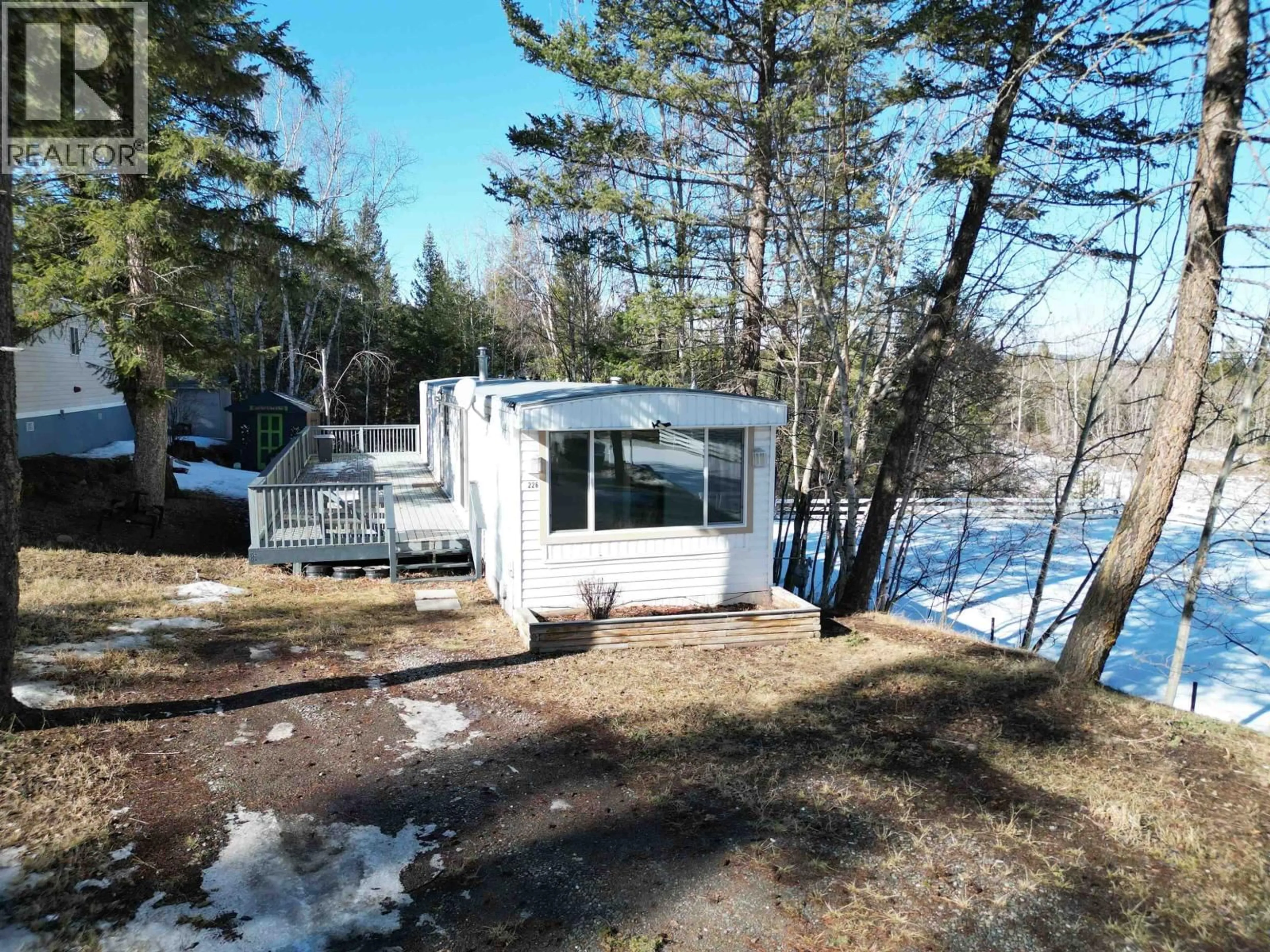 A pic from outside/outdoor area/front of a property/back of a property/a pic from drone, water/lake/river/ocean view for 226 - 1427 DOG CREEK ROAD, Williams Lake British Columbia V2G3H3