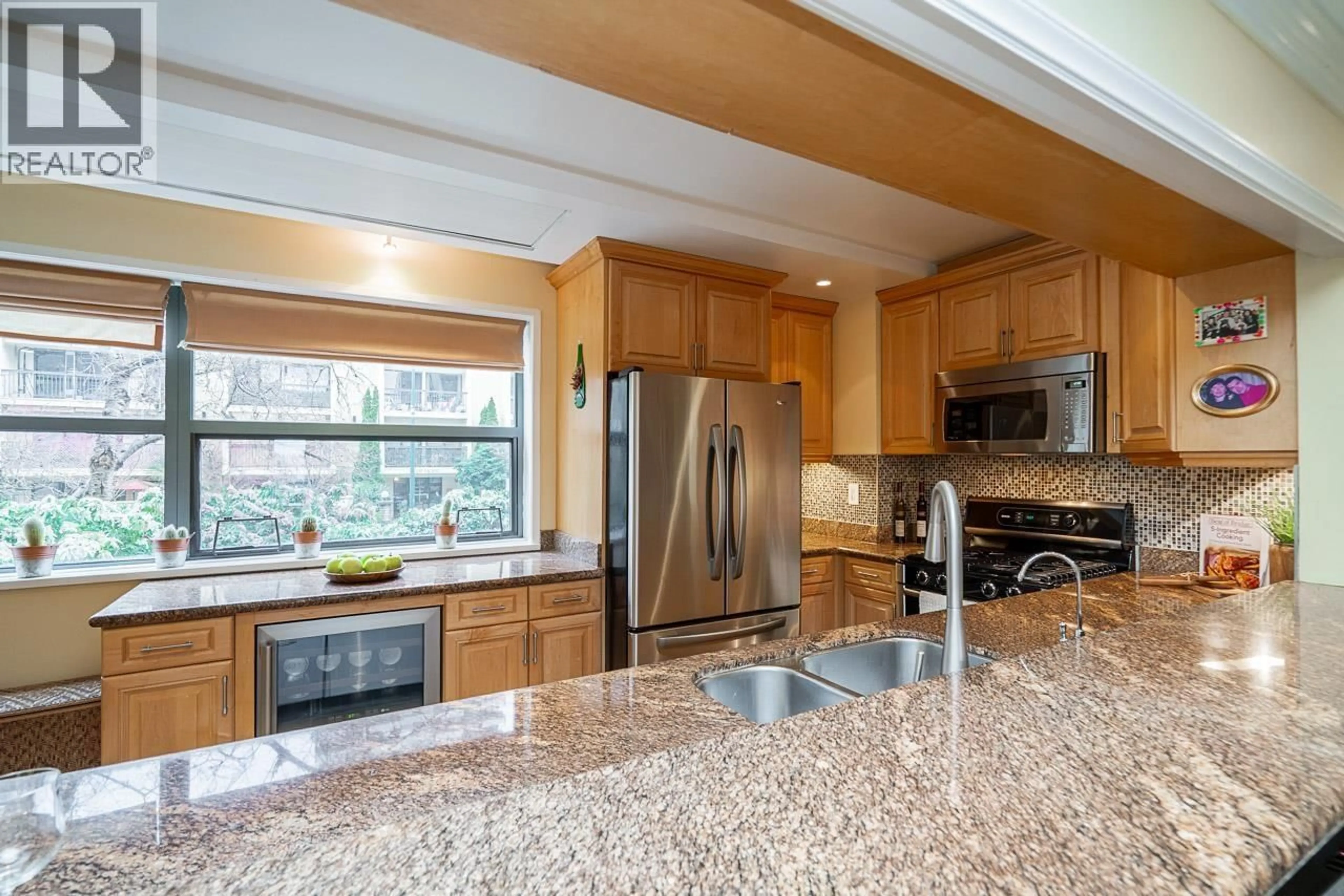 Open concept kitchen, ceramic/tile floor for 304 - 1233 BEACH AVENUE, Vancouver British Columbia V6E1V4