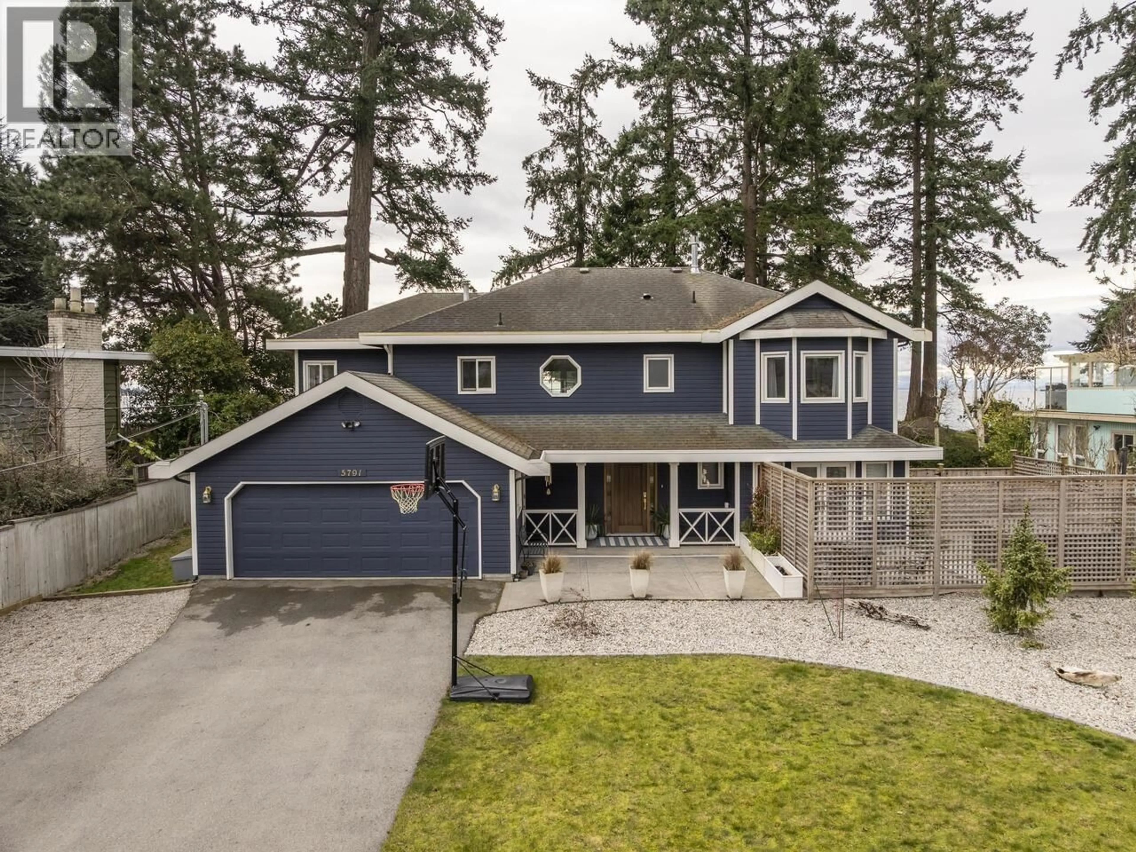 A pic from outside/outdoor area/front of a property/back of a property/a pic from drone, street for 5791 WINDWARD LANE, Sechelt British Columbia V0N3A0