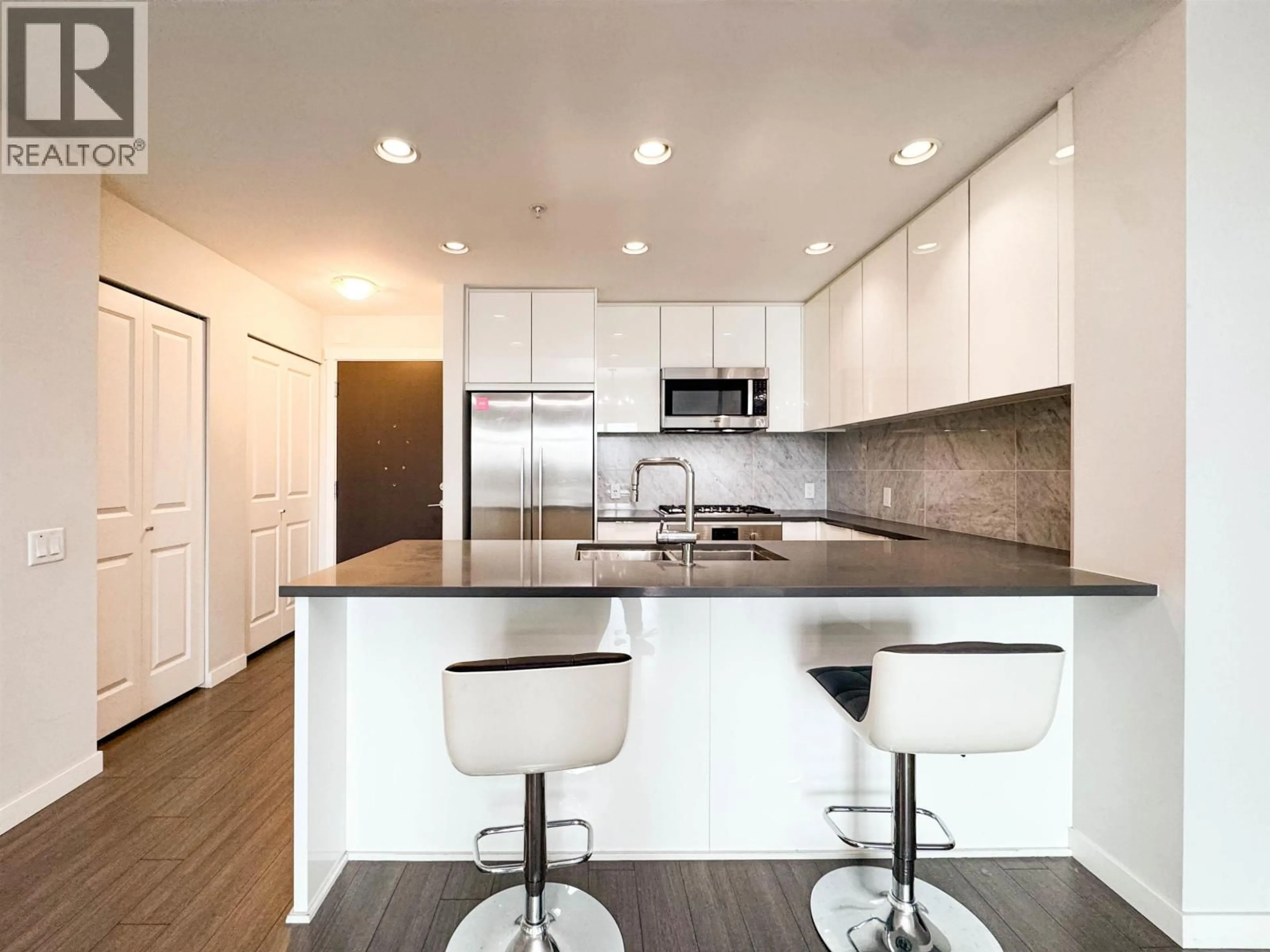 Contemporary kitchen, wood/laminate floor for 404 - 3289 RIVERWALK AVENUE, Vancouver British Columbia V5S0G2