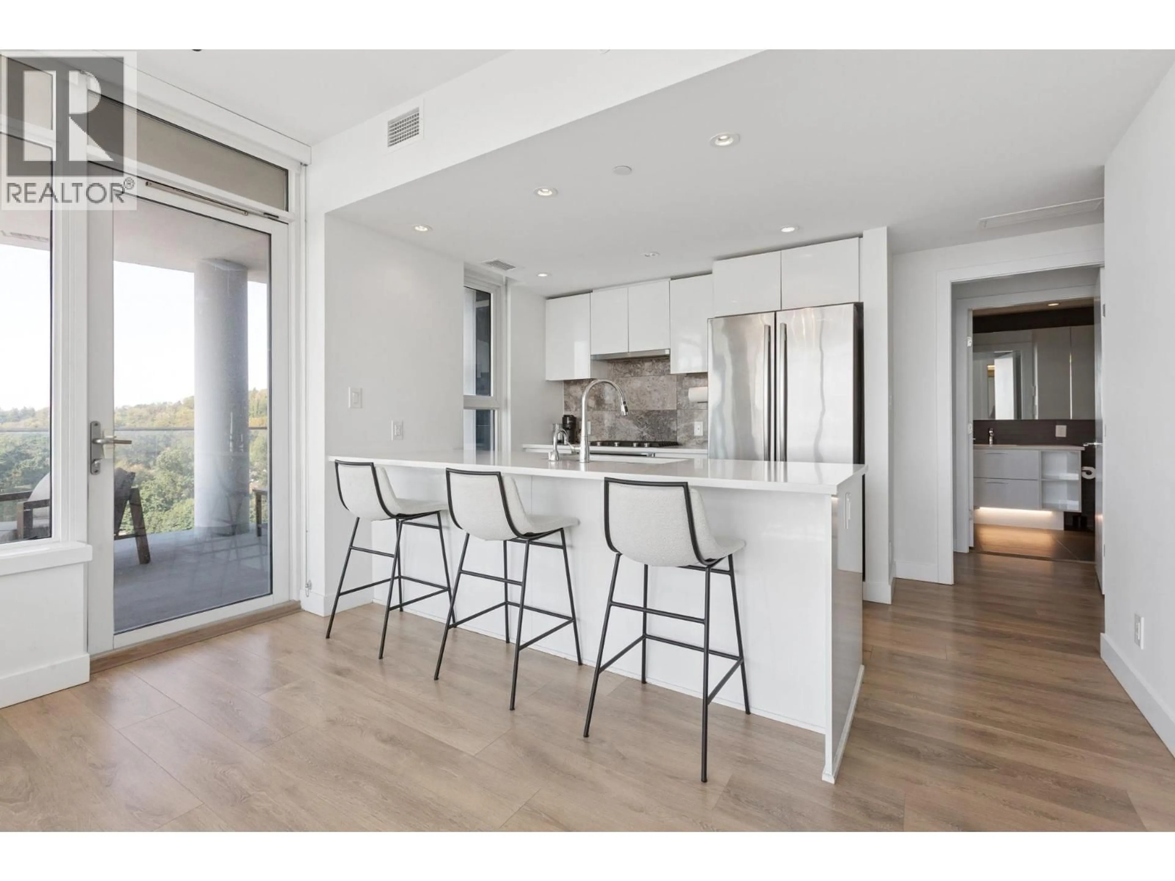 Open concept kitchen, wood/laminate floor for 2107 - 8538 RIVER DISTRICT CROSSING, Vancouver British Columbia V5S0C9