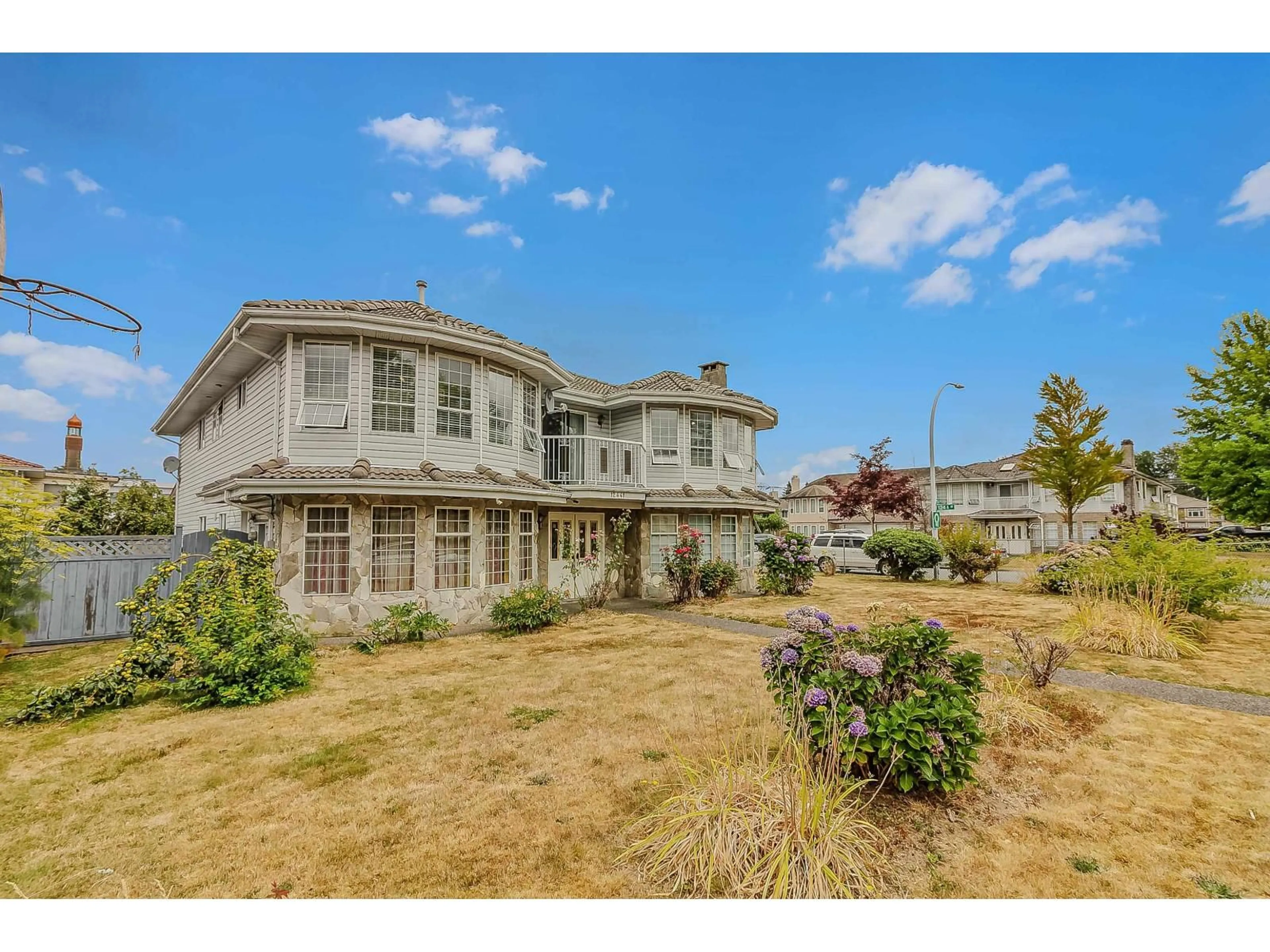 A pic from outside/outdoor area/front of a property/back of a property/a pic from drone, street for 12441 71A AVENUE, Surrey British Columbia V3W0P7