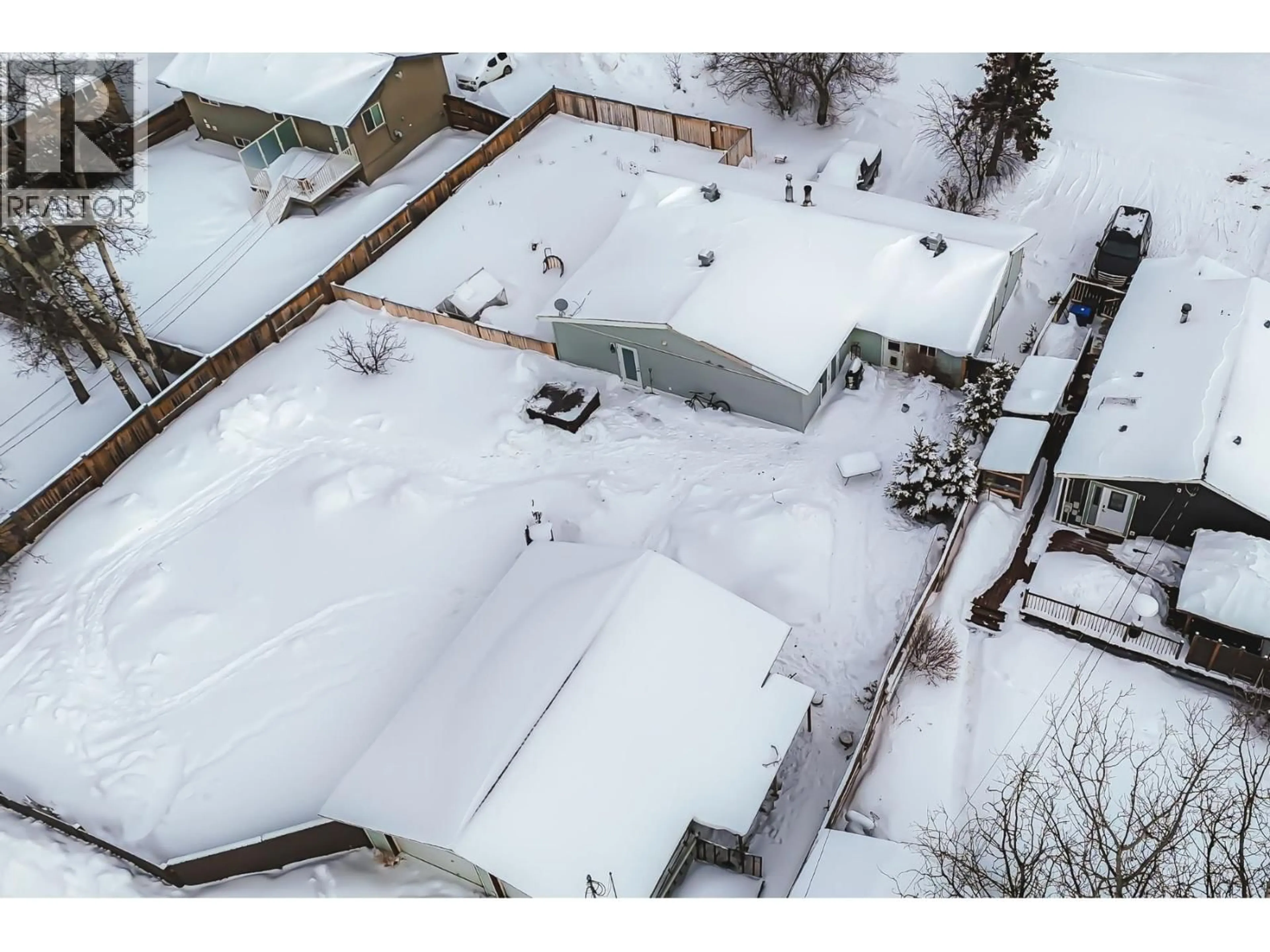 A pic from outside/outdoor area/front of a property/back of a property/a pic from drone, street for 8311 99 AVENUE, Fort St. John British Columbia V1J1S8