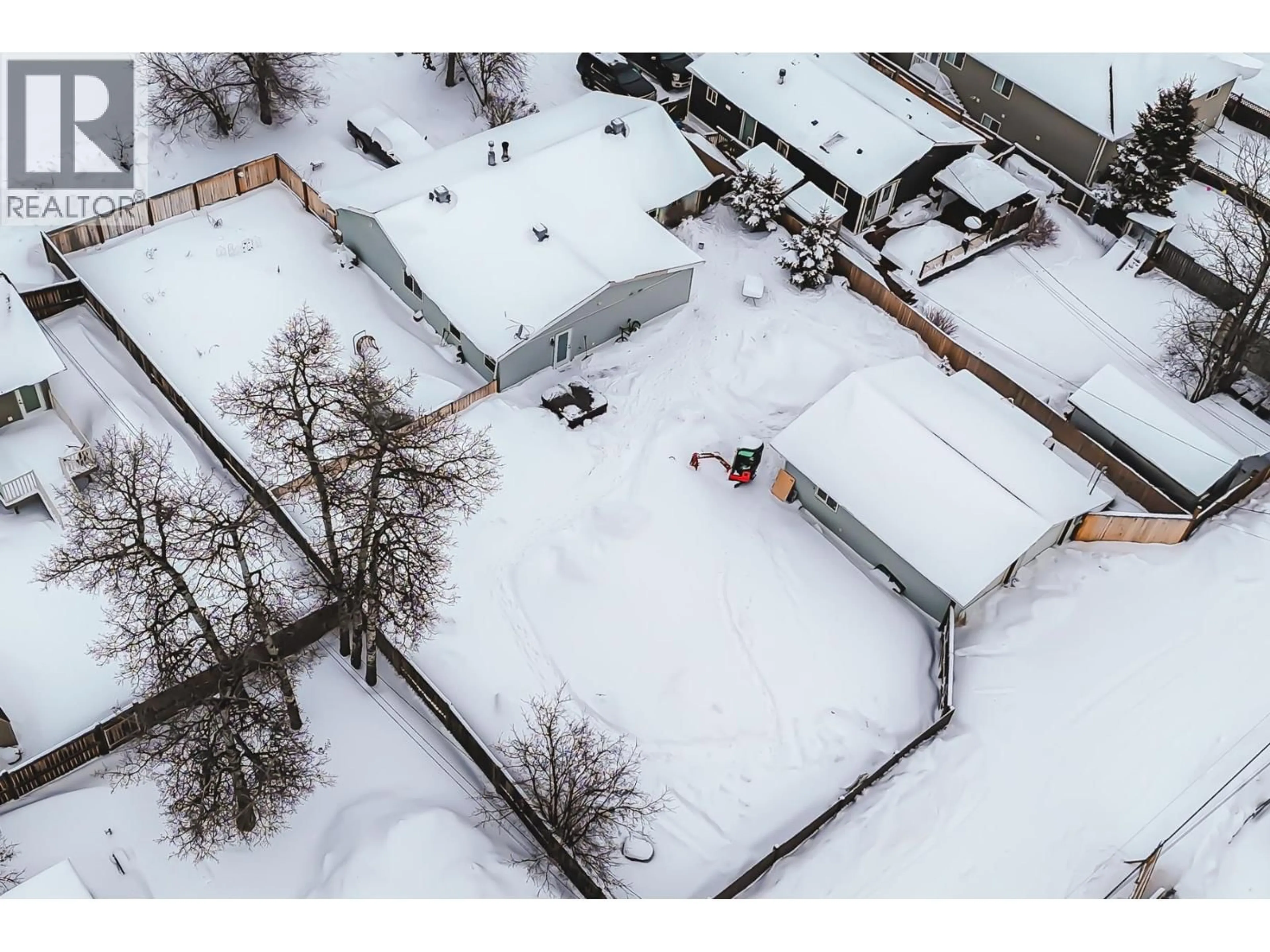 A pic from outside/outdoor area/front of a property/back of a property/a pic from drone, building for 8311 99 AVENUE, Fort St. John British Columbia V1J1S8