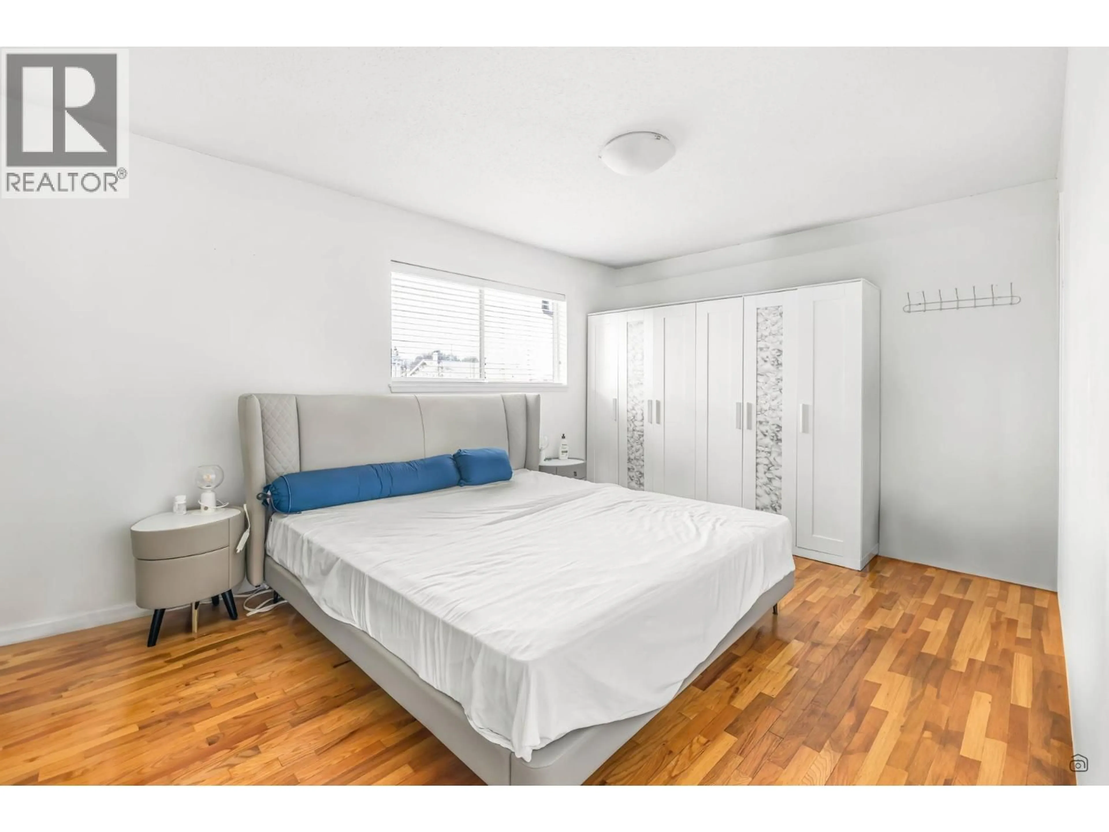 Bedroom with bed, wood/laminate floor for 10580 SEAHAM CRESCENT, Richmond British Columbia V7A3Y7