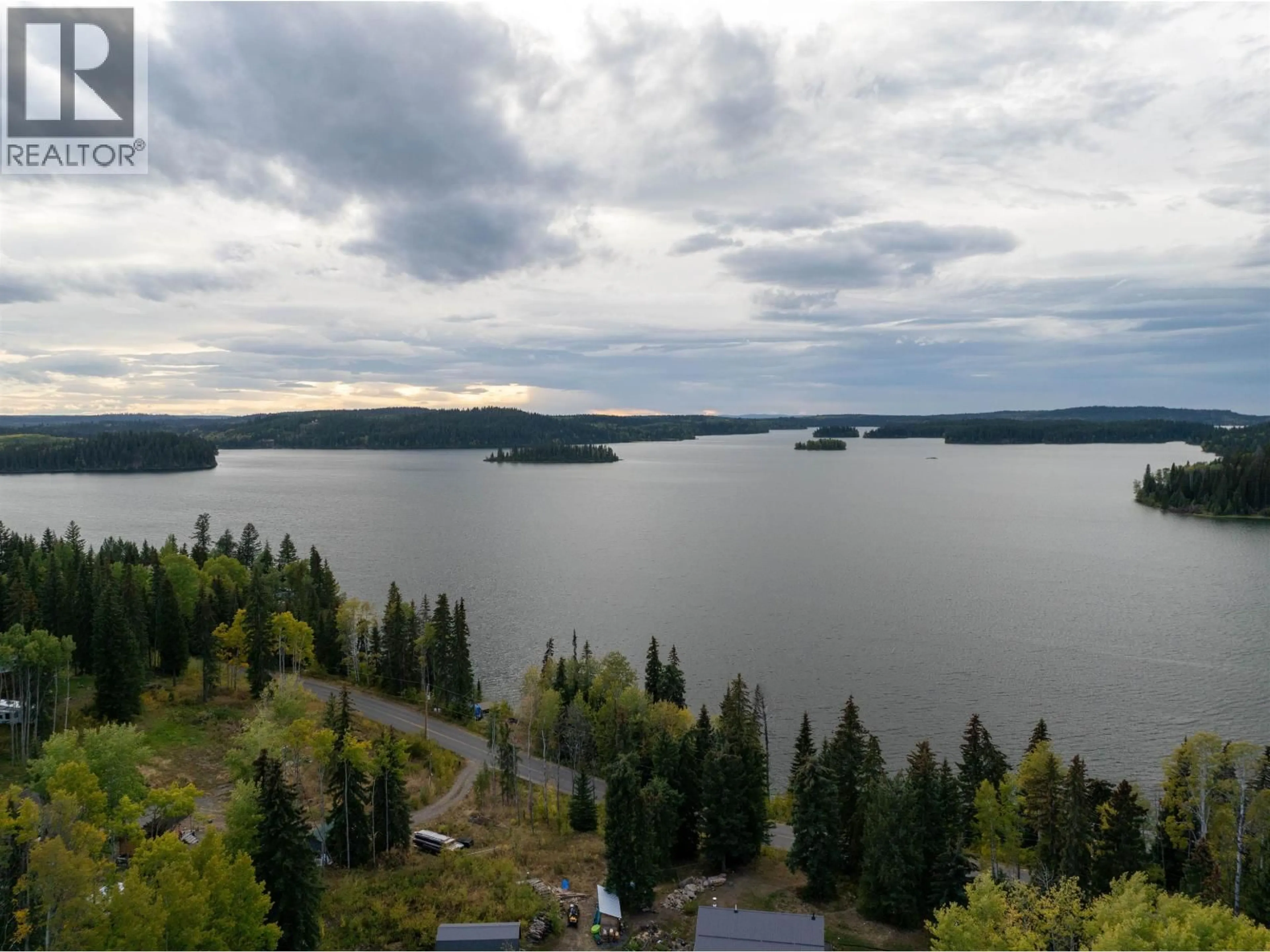 A pic from outside/outdoor area/front of a property/back of a property/a pic from drone, water/lake/river/ocean view for 8399 BRIDGE LAKE ROAD, Bridge Lake British Columbia V0K1X2