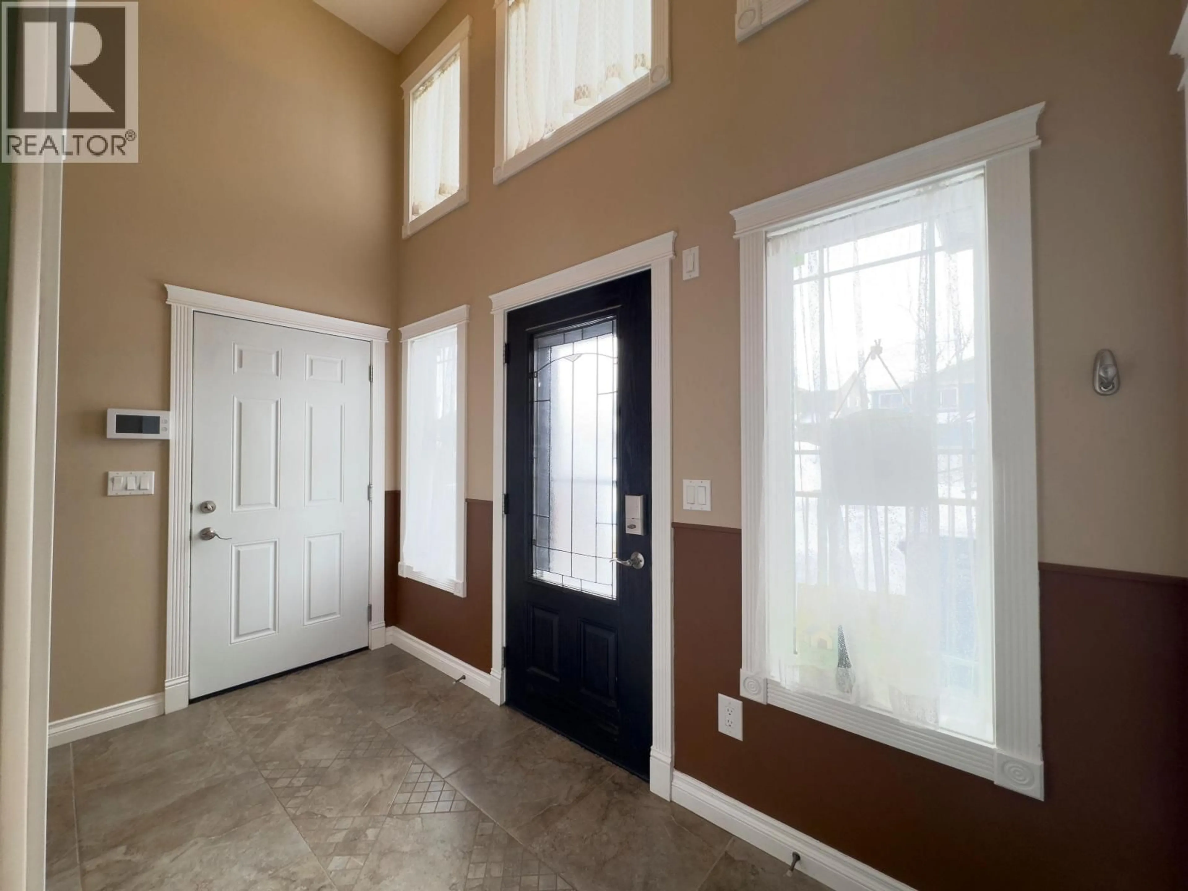 Indoor entryway for 10916 104A AVENUE, Fort St. John British Columbia V1J0J3